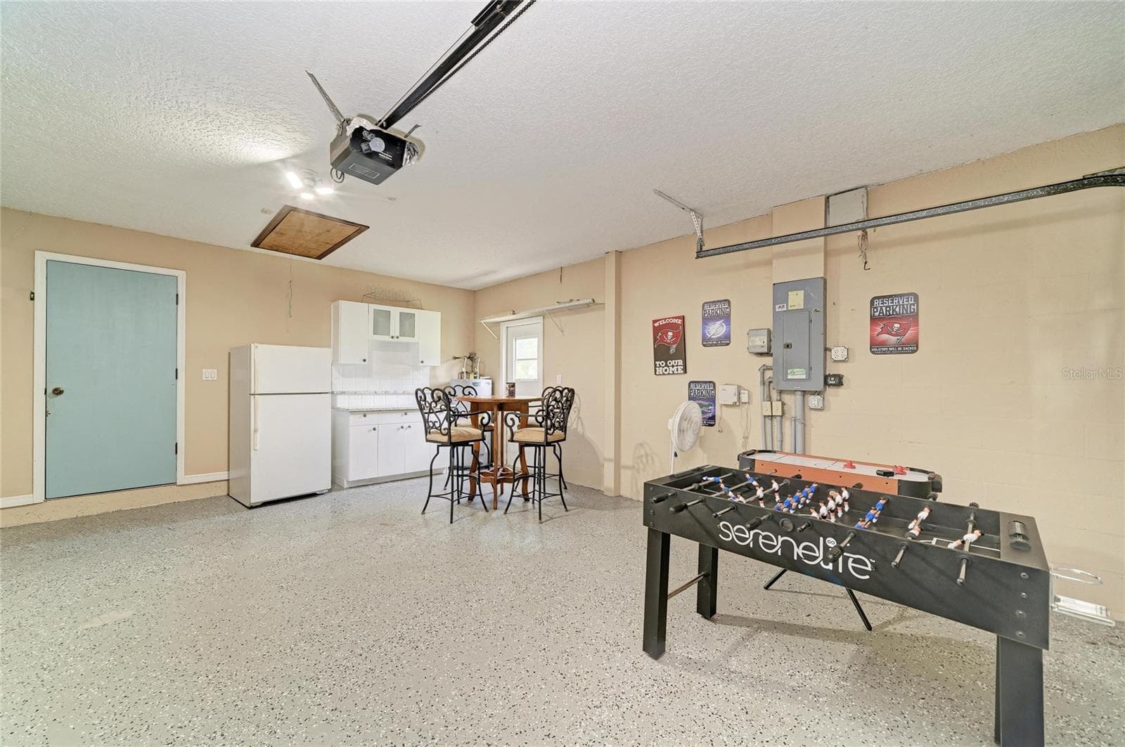 Epoxy floor in Garage, along with extra storage cabinetry. - 6519 28TH AVE E, BRADENTON