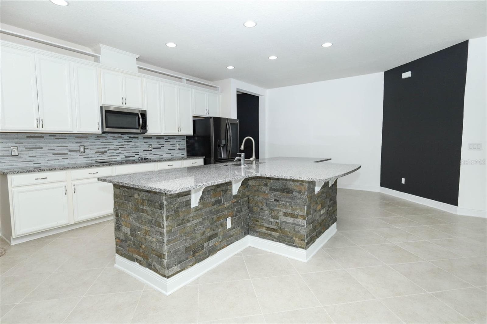 KITHCEN ANGLE RIGHT SIDE OF HOME - 12397 STONE BARK TRL, ORLANDO