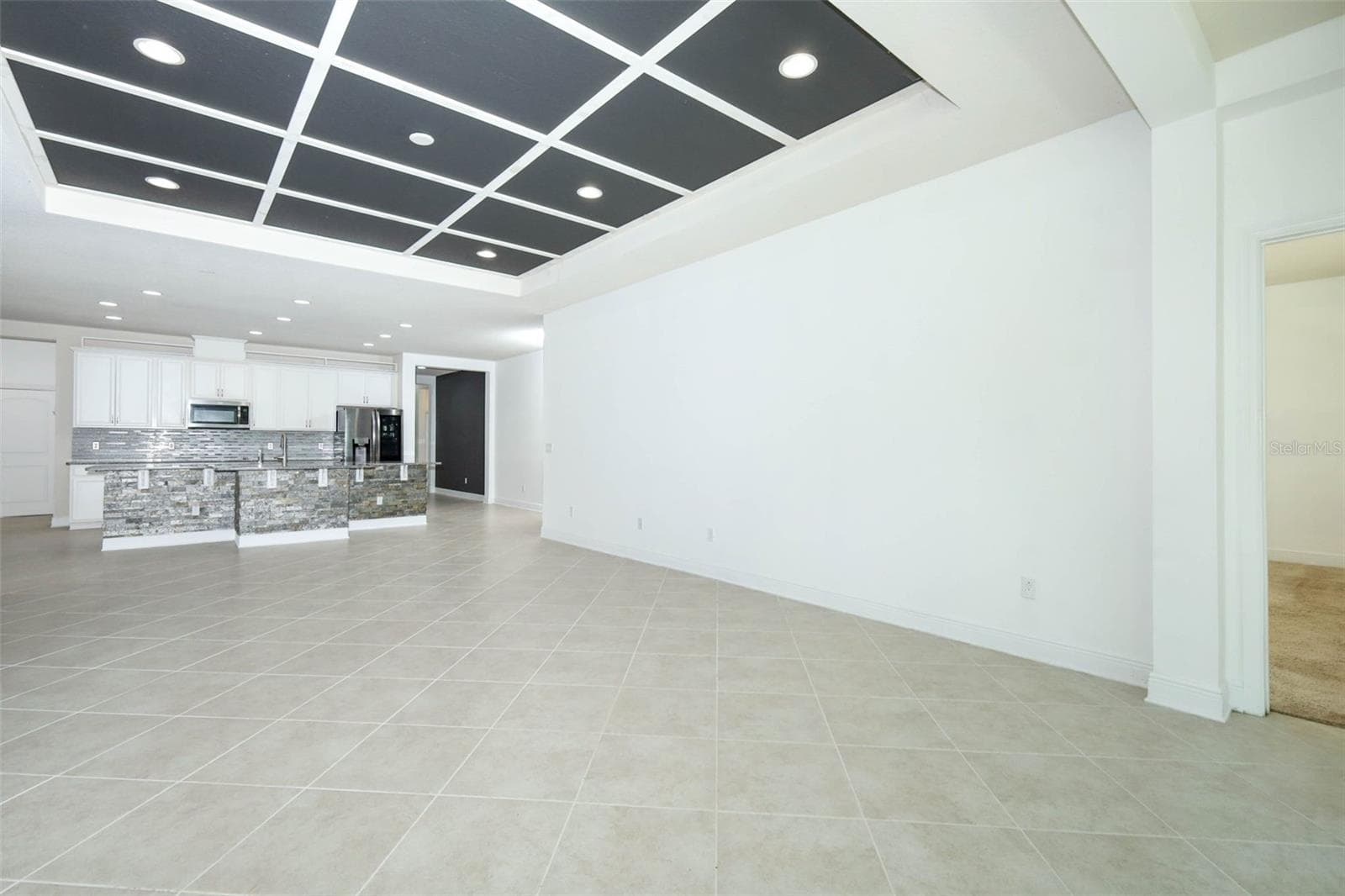 VIEW OF FAMILY ROOM & KITCHEN - 12397 STONE BARK TRL, ORLANDO