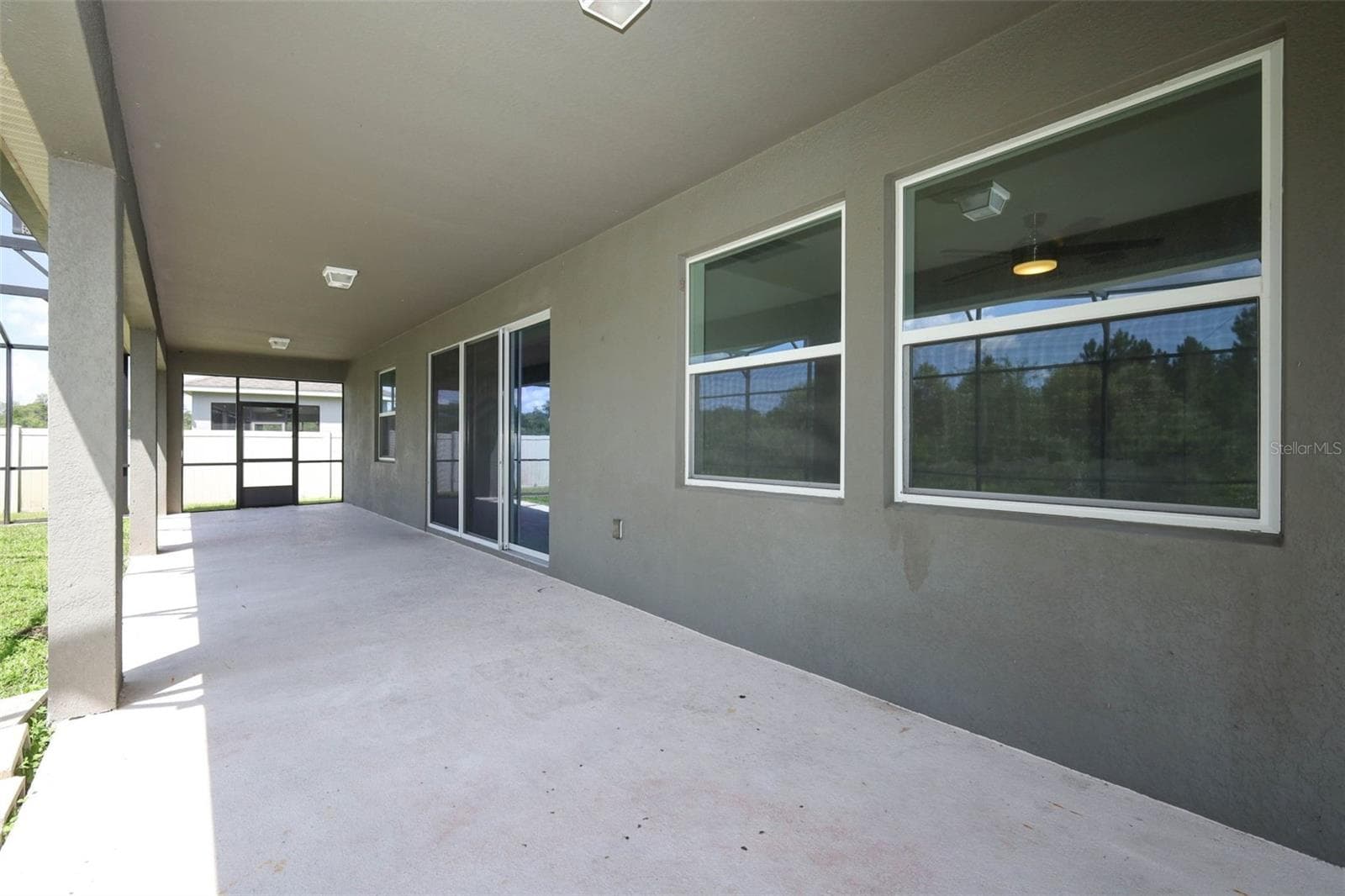 Spacious open lanai, perfect for a family seating area. - 12397 STONE BARK TRL, ORLANDO