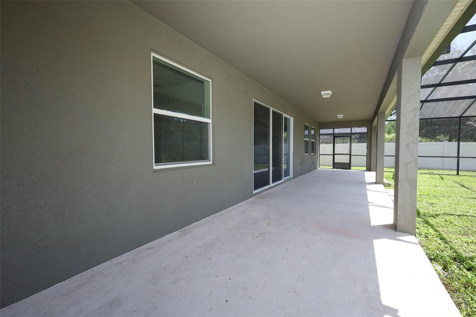 lanai featuring a large, open-concept living space. - 12397 STONE BARK TRL, ORLANDO