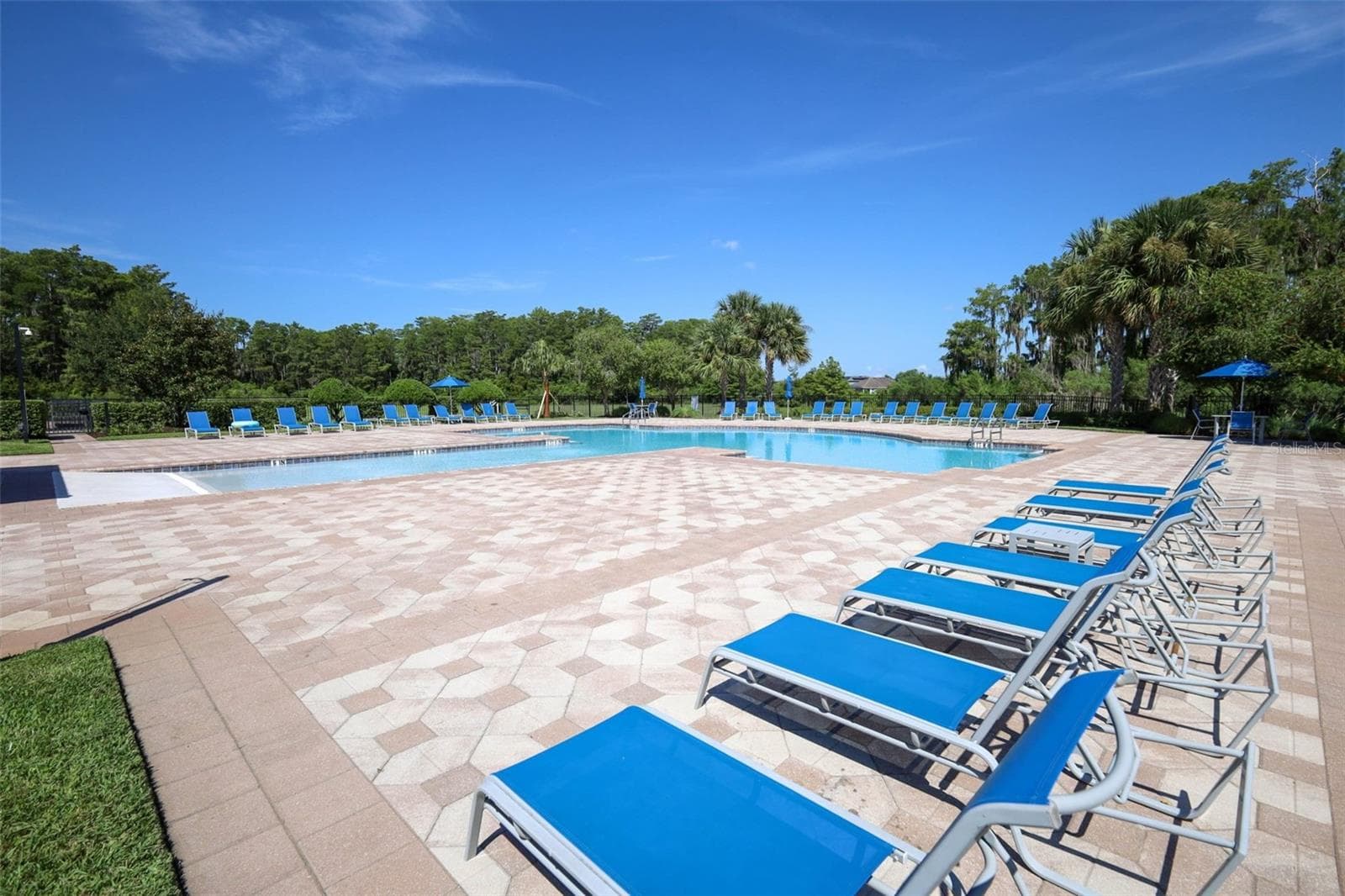 COMMUNITY POOL SITTING AREA - 12397 STONE BARK TRL, ORLANDO