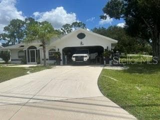 GARAGE PARKS TWO CARS AND DRIVEWAY A FEW MORE - 3550 S SUMTER BLVD, NORTH PORT