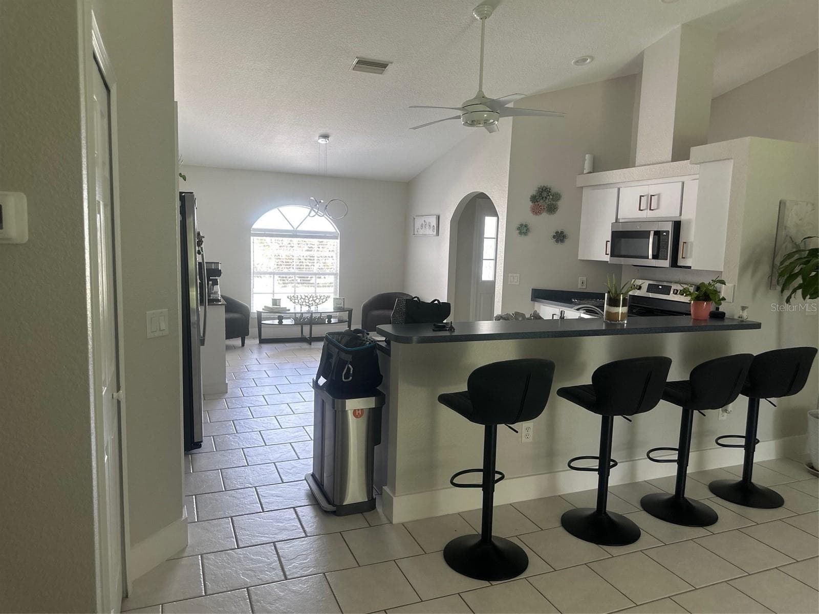 VIEW FROM EAT IN KITCHEN TO THE BREAKFAST BAR - 3550 S SUMTER BLVD, NORTH PORT