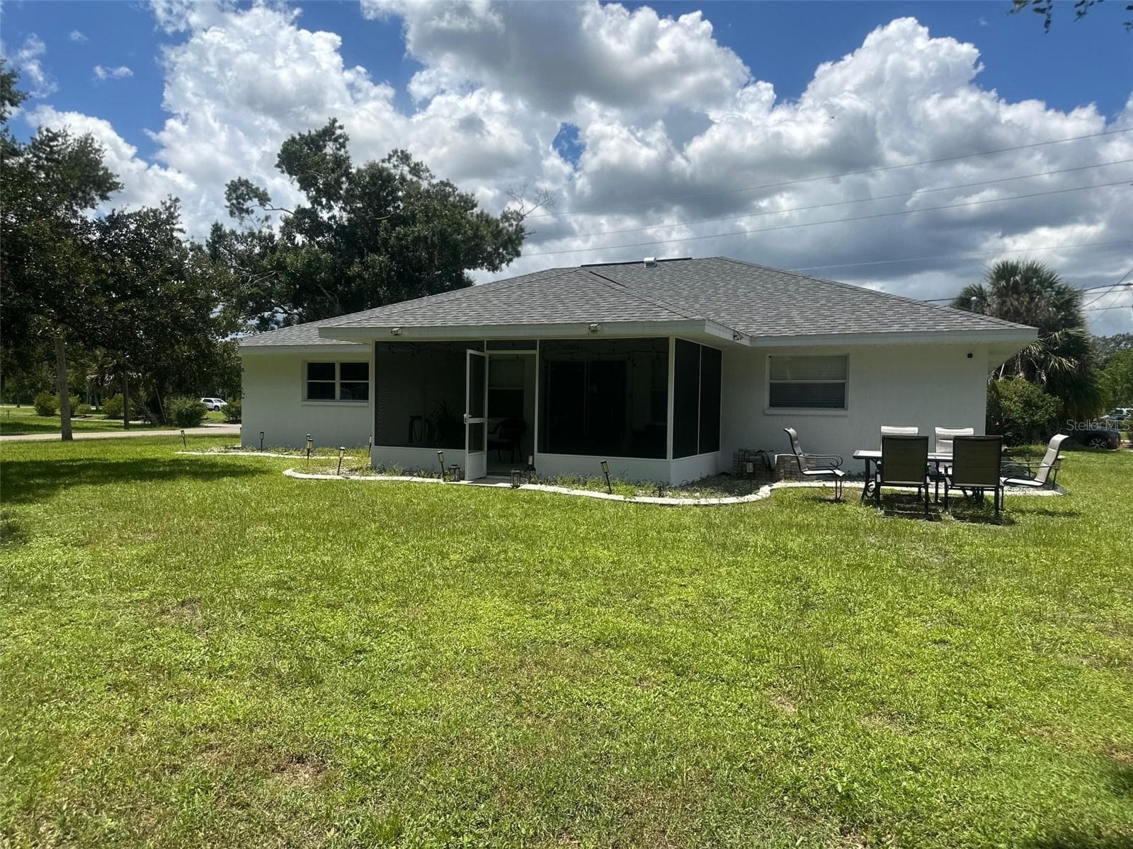 REAR VIEW OF THE PATIO, IS A .33 ACRE LOT - 3550 S SUMTER BLVD, NORTH PORT