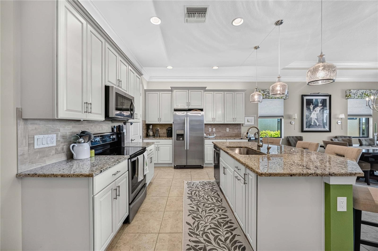 light cabinets and granite, - 24232 GALLBERRY DR, VENICE
