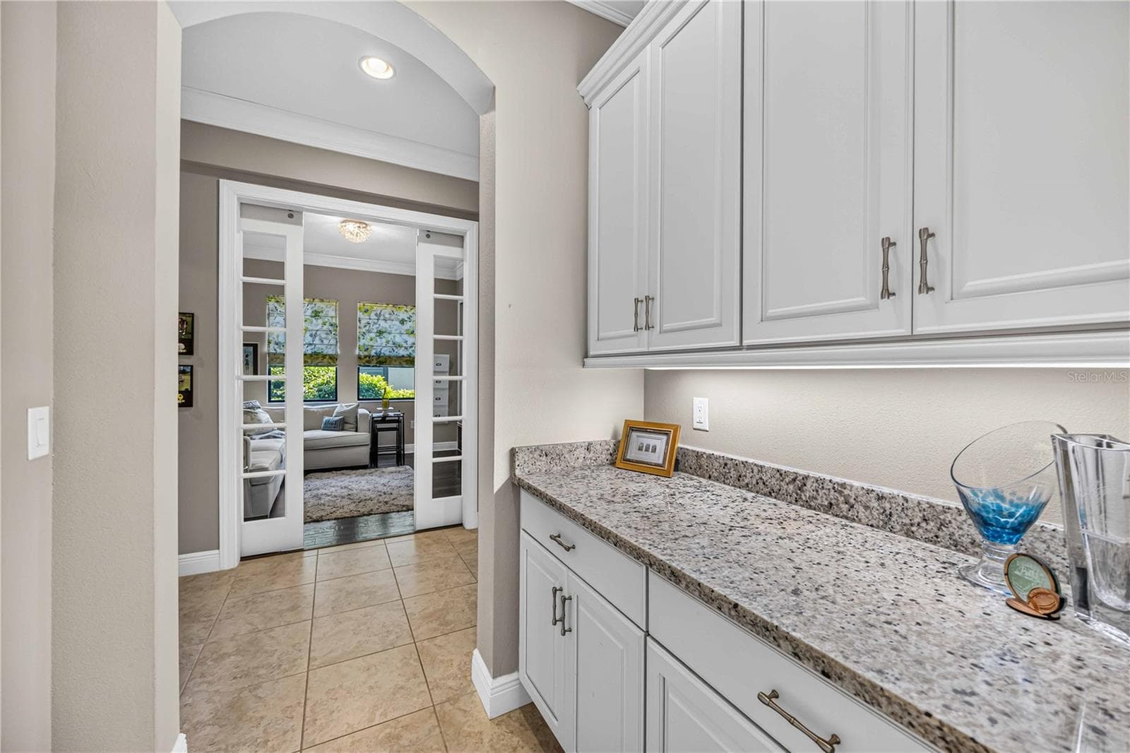 The drop zone off the garage and laundry room is fabulous for in and out organization. - 24232 GALLBERRY DR, VENICE