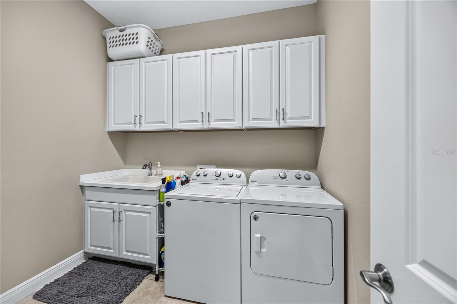 Large Laundry room is wide enough to hold a full size refrigerator and all essentials - 24232 GALLBERRY DR, VENICE