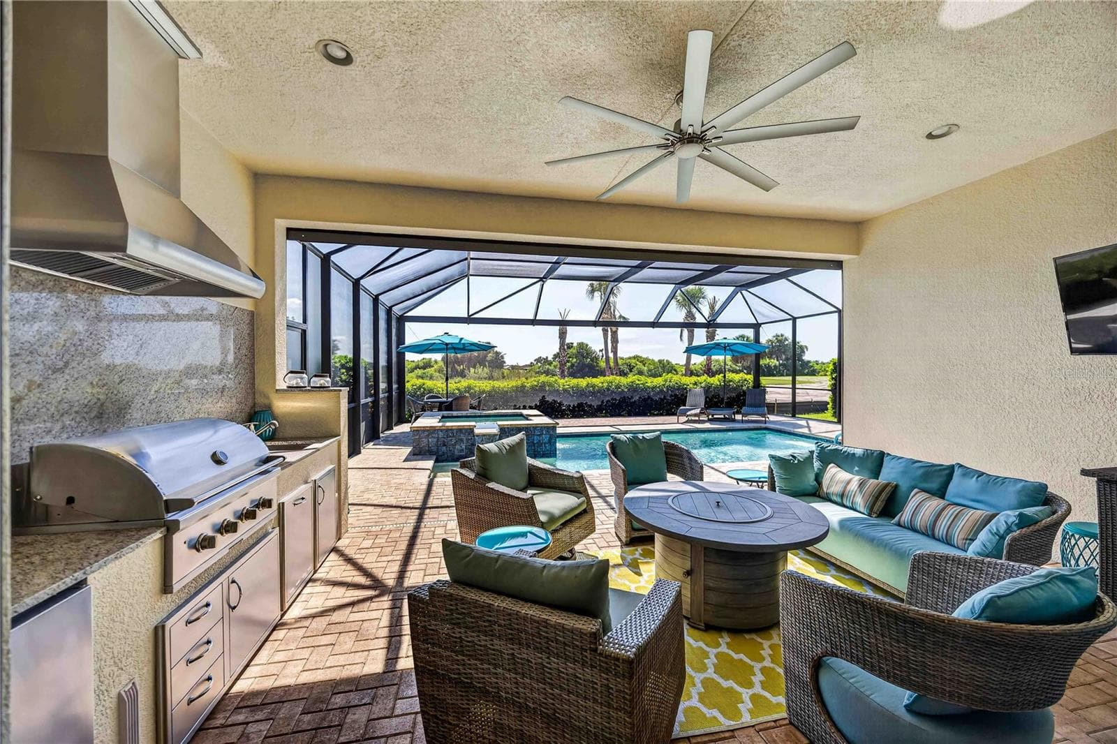 The lanai features a stunning outdoor kitchen - 24232 GALLBERRY DR, VENICE