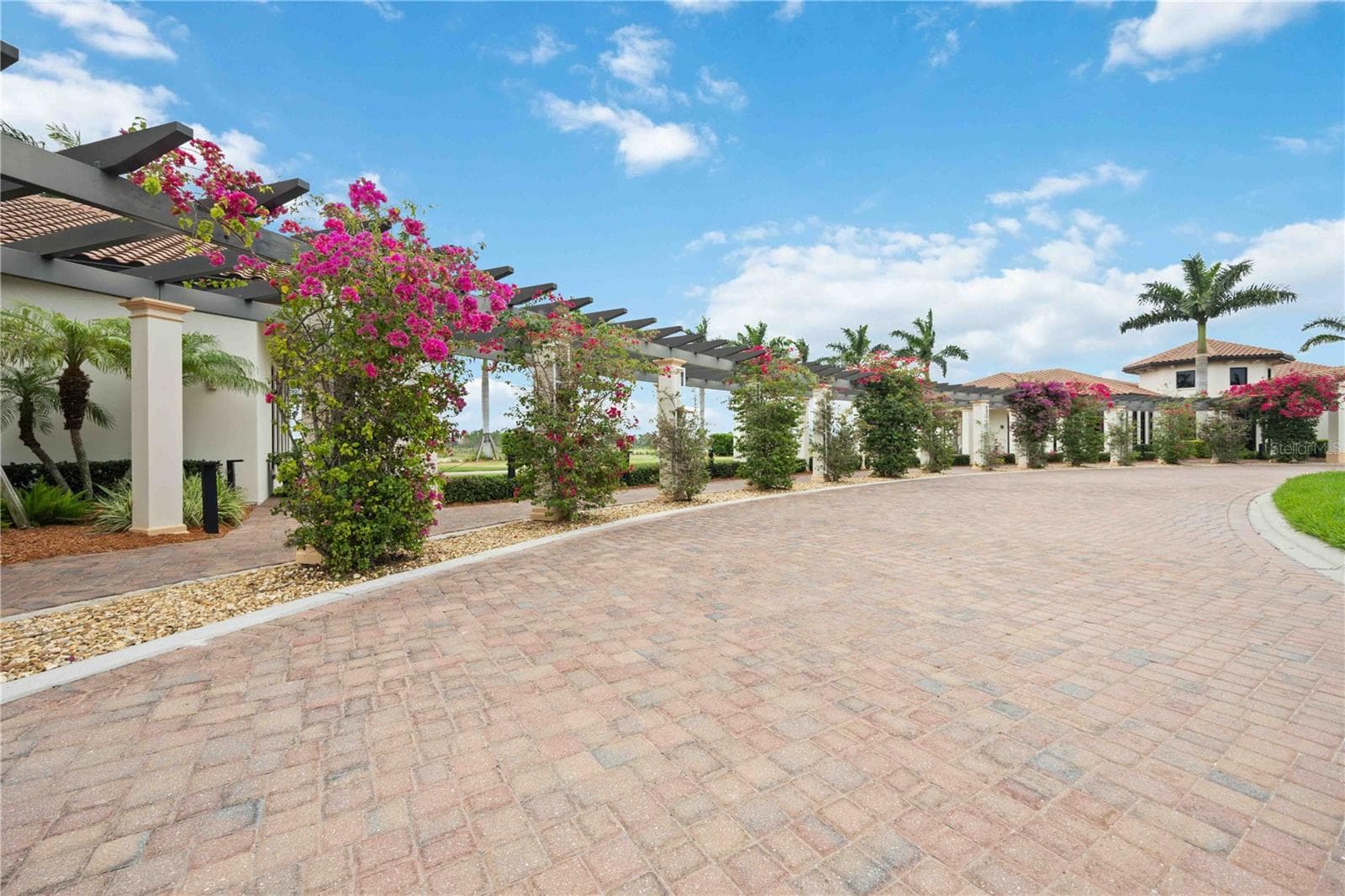 The Welcome Center surrounded by bouganviella - beautiful - 24232 GALLBERRY DR, VENICE