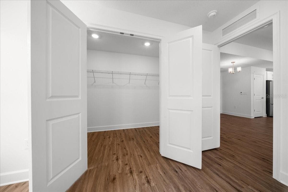 Primary Bedroom with Walk-in Closet - 6241 FREEPORT DR, SPRING HILL
