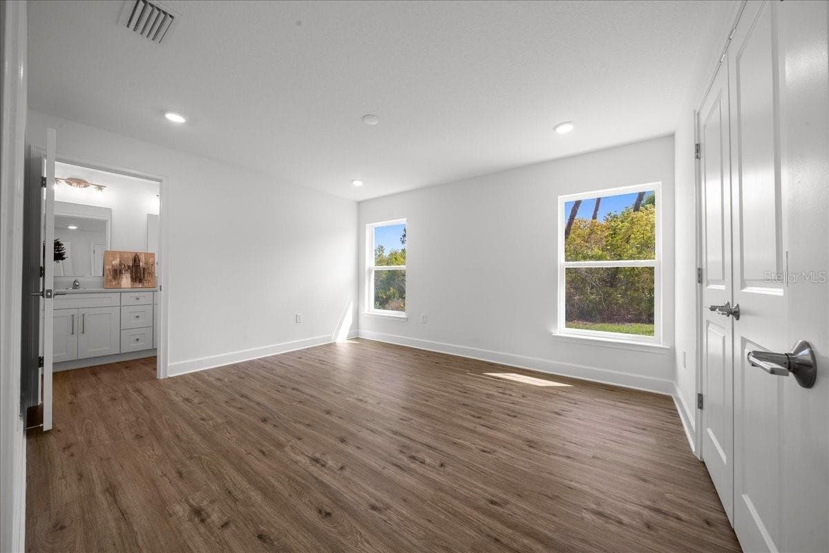 Spacious Primary Bedroom with Natural Light - 6241 FREEPORT DR, SPRING HILL