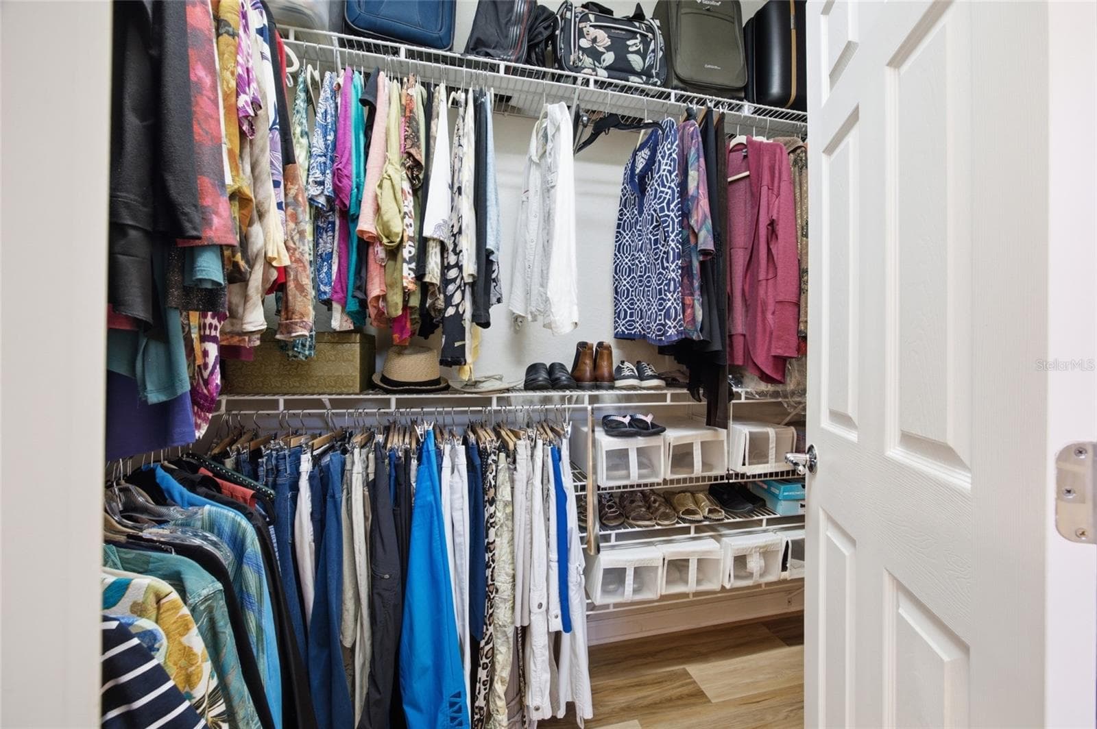 primary bedroom walk in closet - 9457 SW 66TH LOOP, OCALA