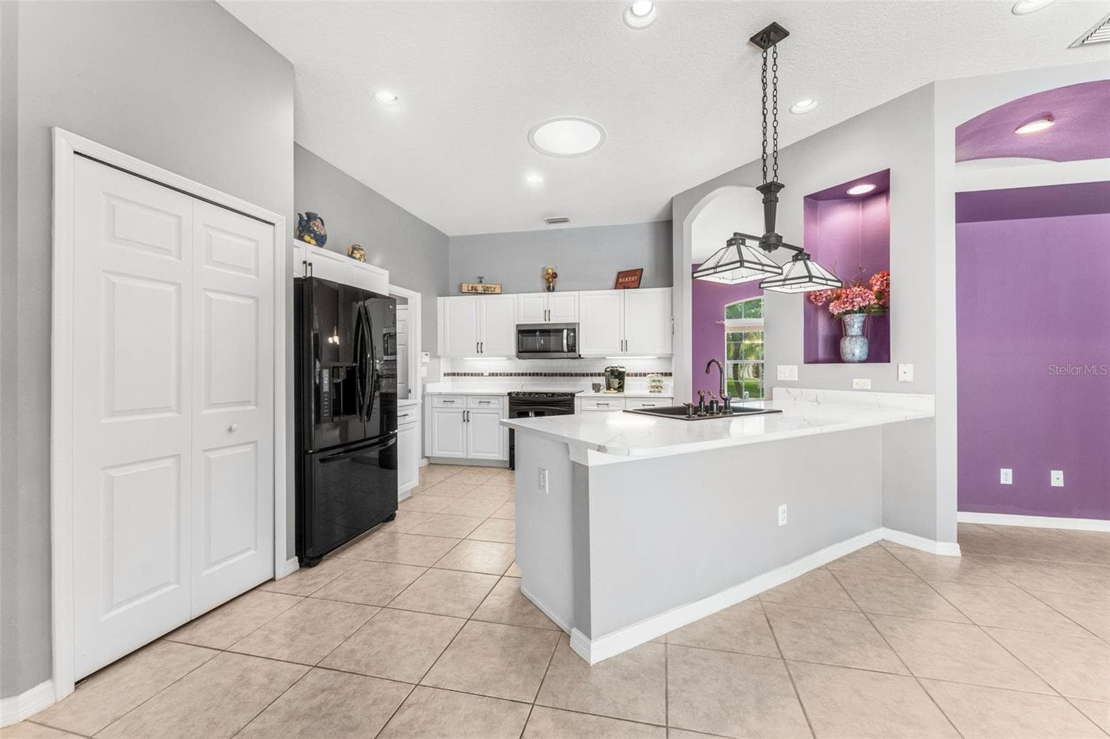 Breakfast nook area to kitchen. - 1903 CREEKWATER BLVD, PORT ORANGE