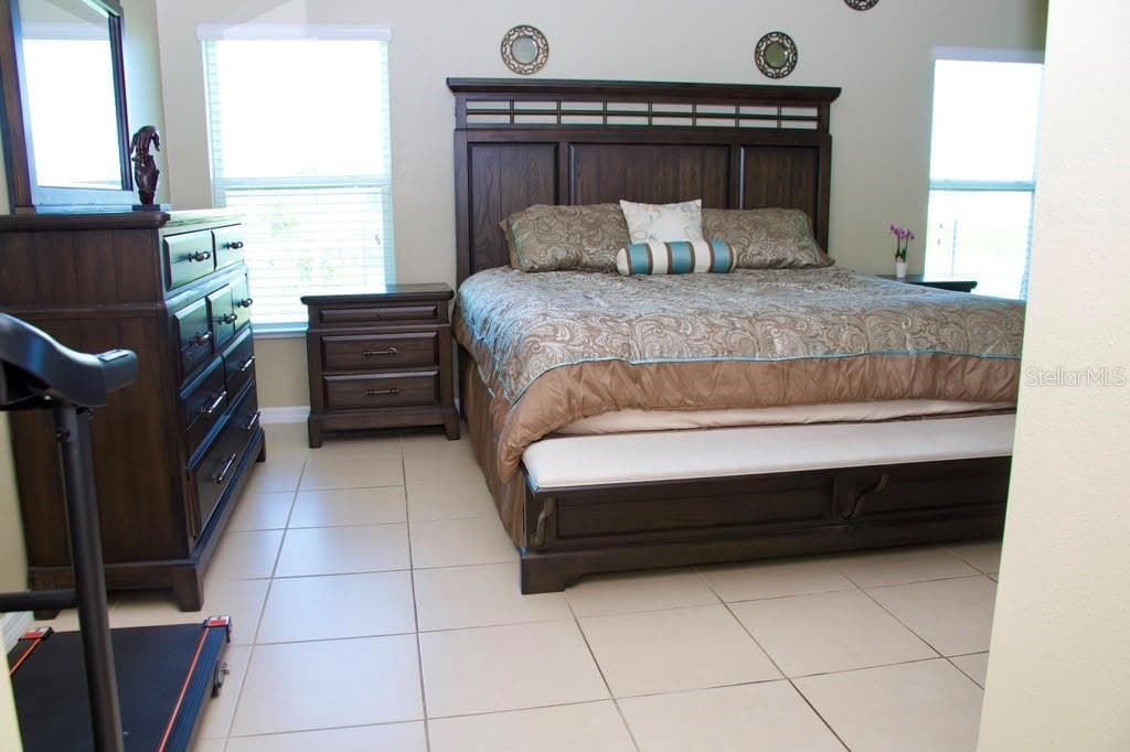 Primary bedroom - 411 BLUE LAKE CIR, KISSIMMEE