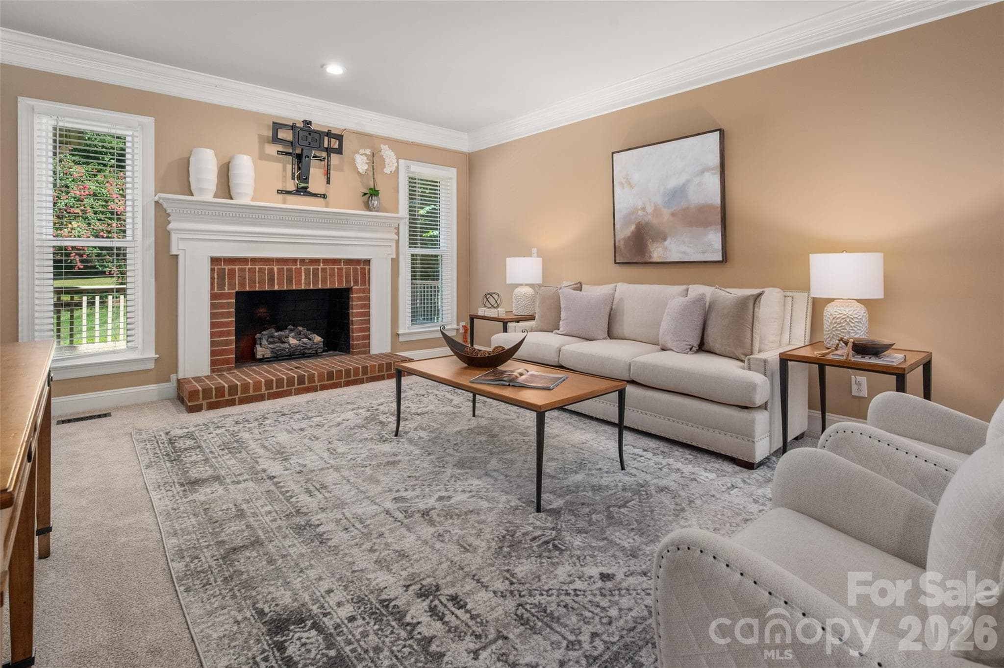 Cozy living room with a gas fireplace. - 12818 Darby Chase Drive, Charlotte
