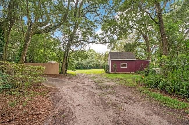 Side of Home to Guesthouse - 560 N LAKE PLEASANT RD, APOPKA