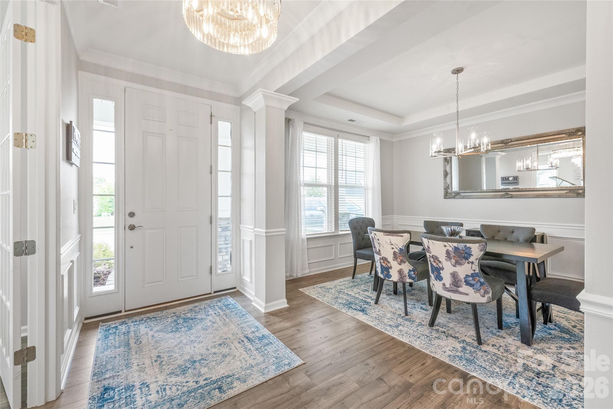 Soaring 8-foot doors throughout the first floor add an elevated, grand feel that enhances the main level's open, airy architecture. - 6440 Ancient Way, Fort Mill