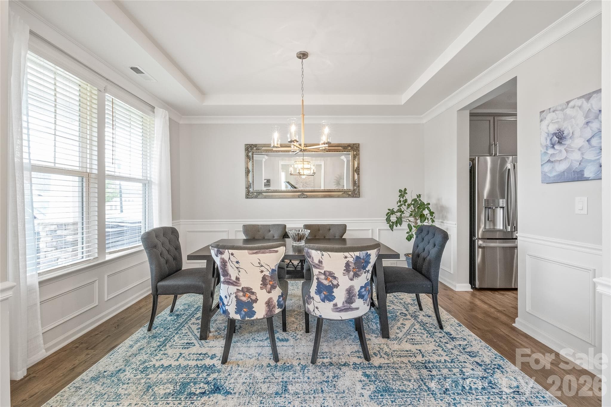Effortlessly flowing from the dining room, the chef’s kitchen offers a seamless layout built for intuitive serving and easy entertaining. - 6440 Ancient Way, Fort Mill