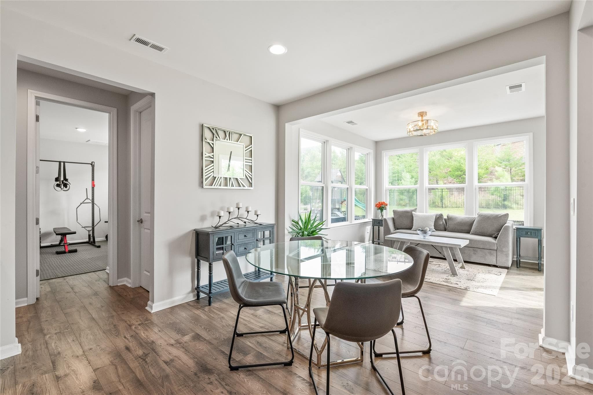 Just off the breakfast area, you'll find a generously sized walk-in pantry alongside a main-level guest bedroom and full bath...a flexible space that easily serves as a home gym, guest suite, or dedicated hobby room. - 6440 Ancient Way, Fort Mill