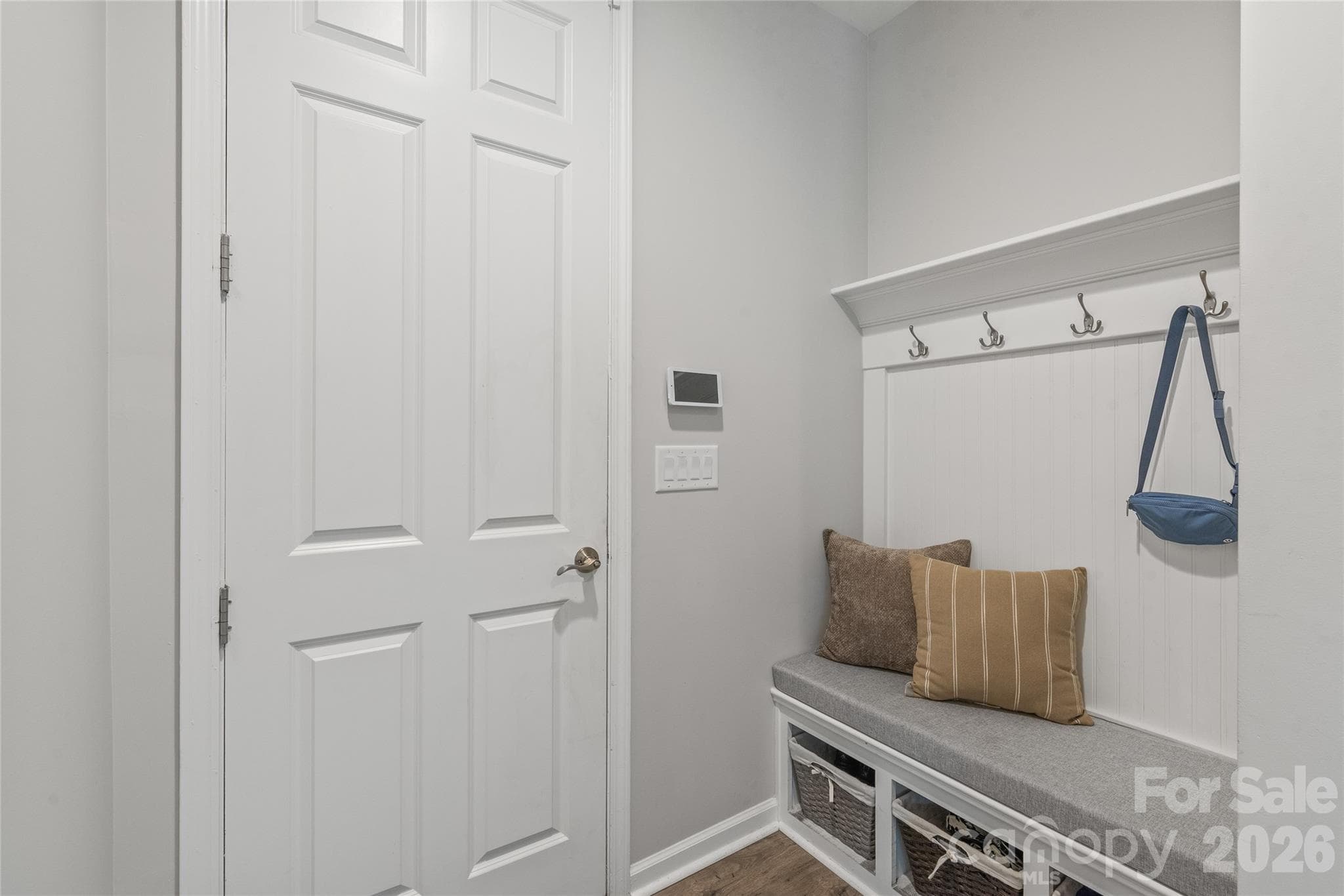 Located right off the garage entry, this convenient drop zone features built-in bench seating, storage cubbies, and coat hooks to keep daily clutter organized and out of sight. - 6440 Ancient Way, Fort Mill
