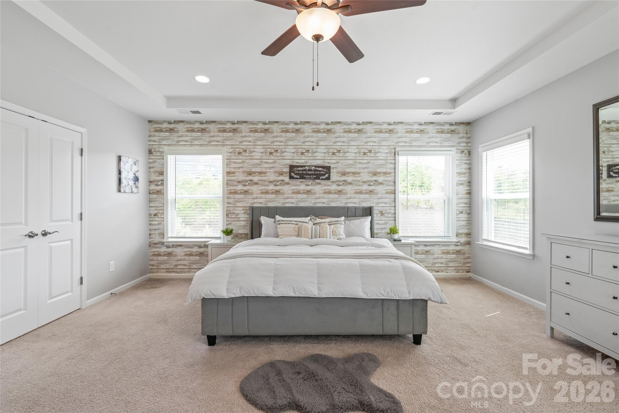 Elegant double doors open directly into the primary ensuite, creating a dramatic, spa-like entrance. - 6440 Ancient Way, Fort Mill