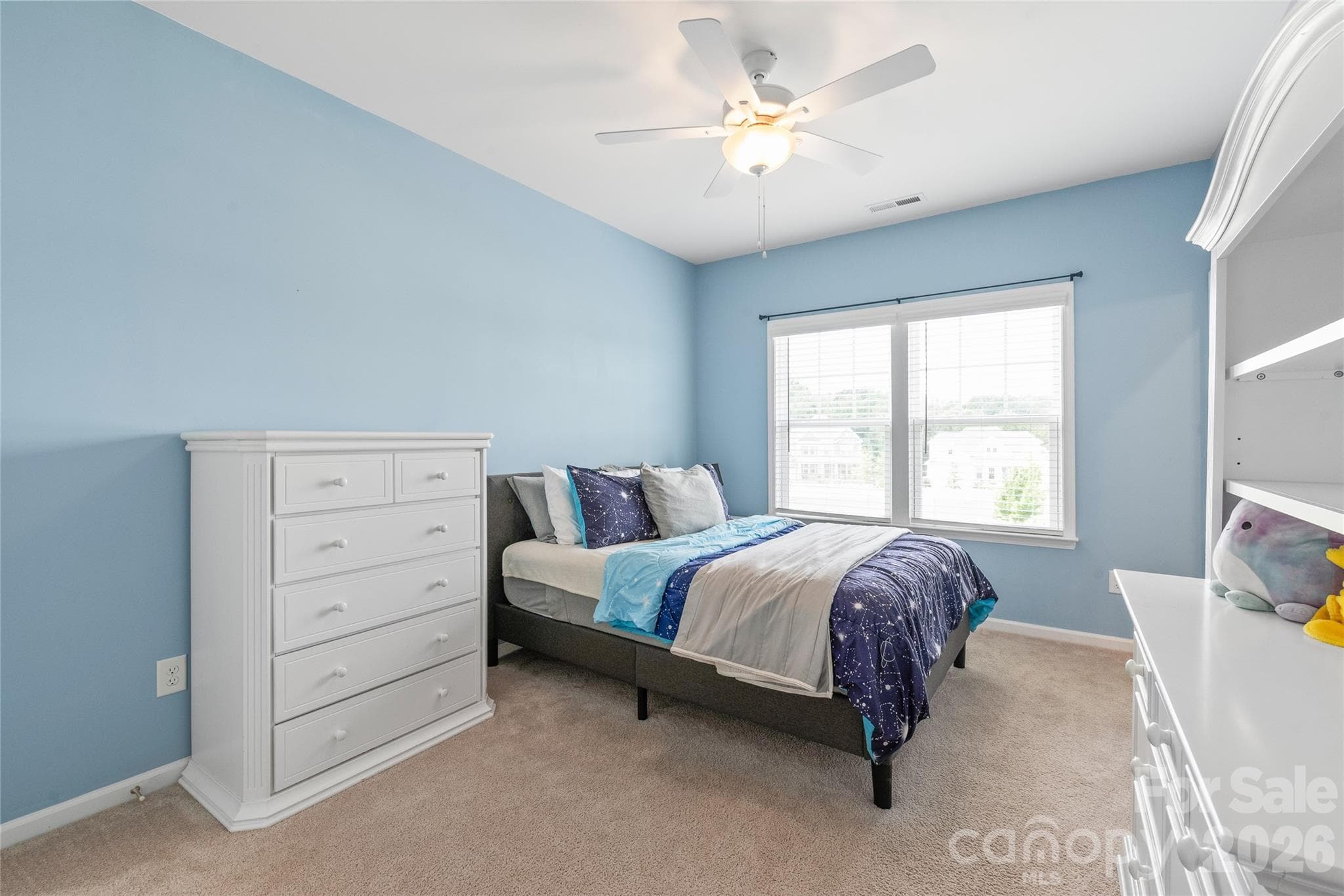 Light-filled and private, this fourth bedroom offers a roomy walk-in closet and seamless Jack-and-Jill bath connectivity. - 6440 Ancient Way, Fort Mill