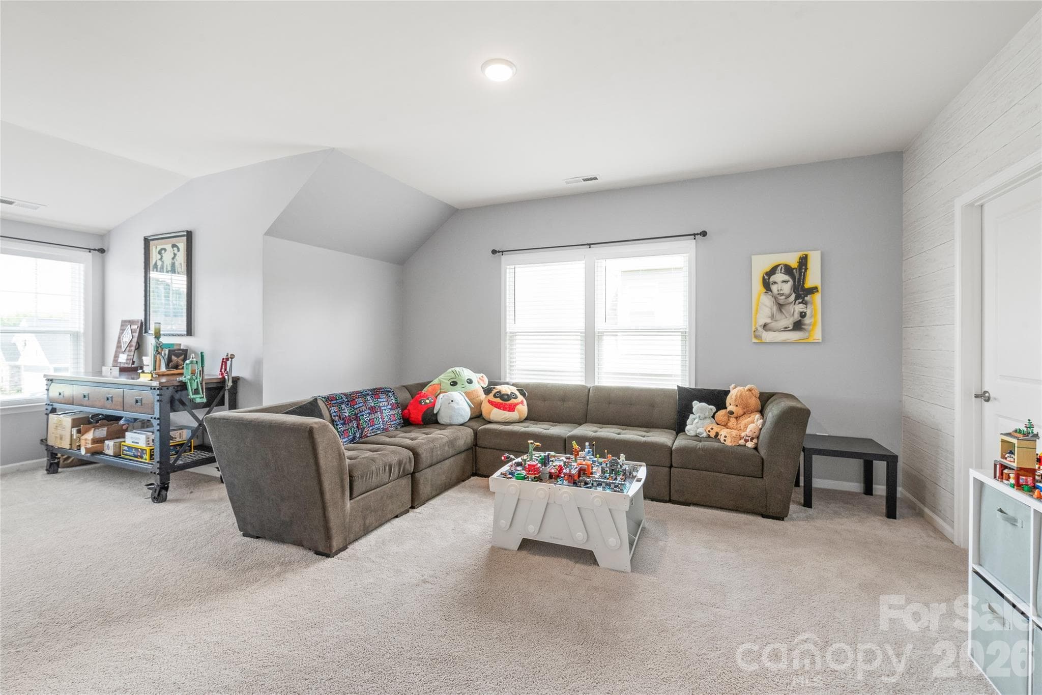 An oversized bonus room that connects directly to a shared full bath with Bedroom 2 - ideal as a home theater or game room. - 6440 Ancient Way, Fort Mill