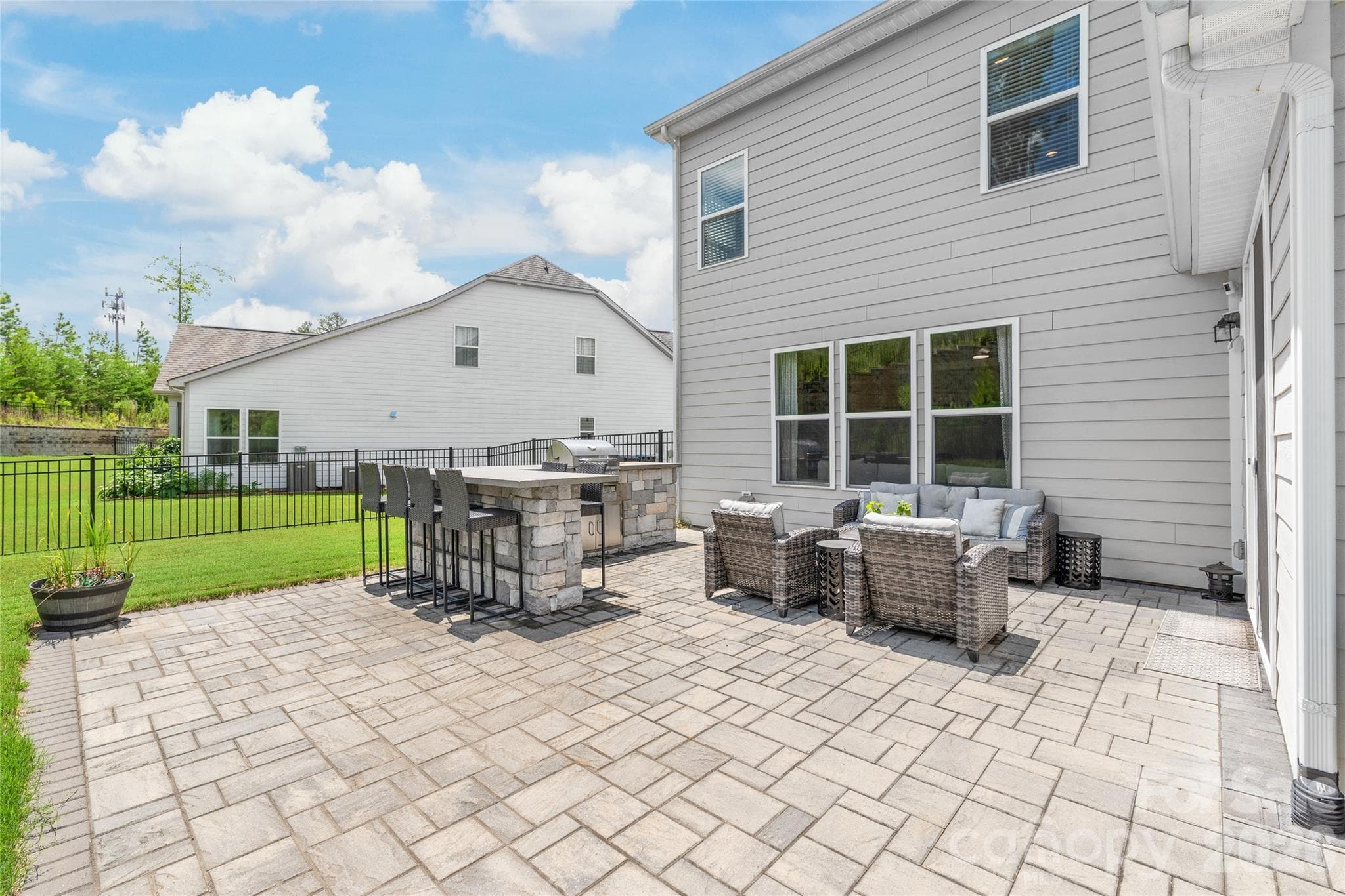 A spacious back patio offering a seamless transition to outdoor living and backyard enjoyment. - 6440 Ancient Way, Fort Mill