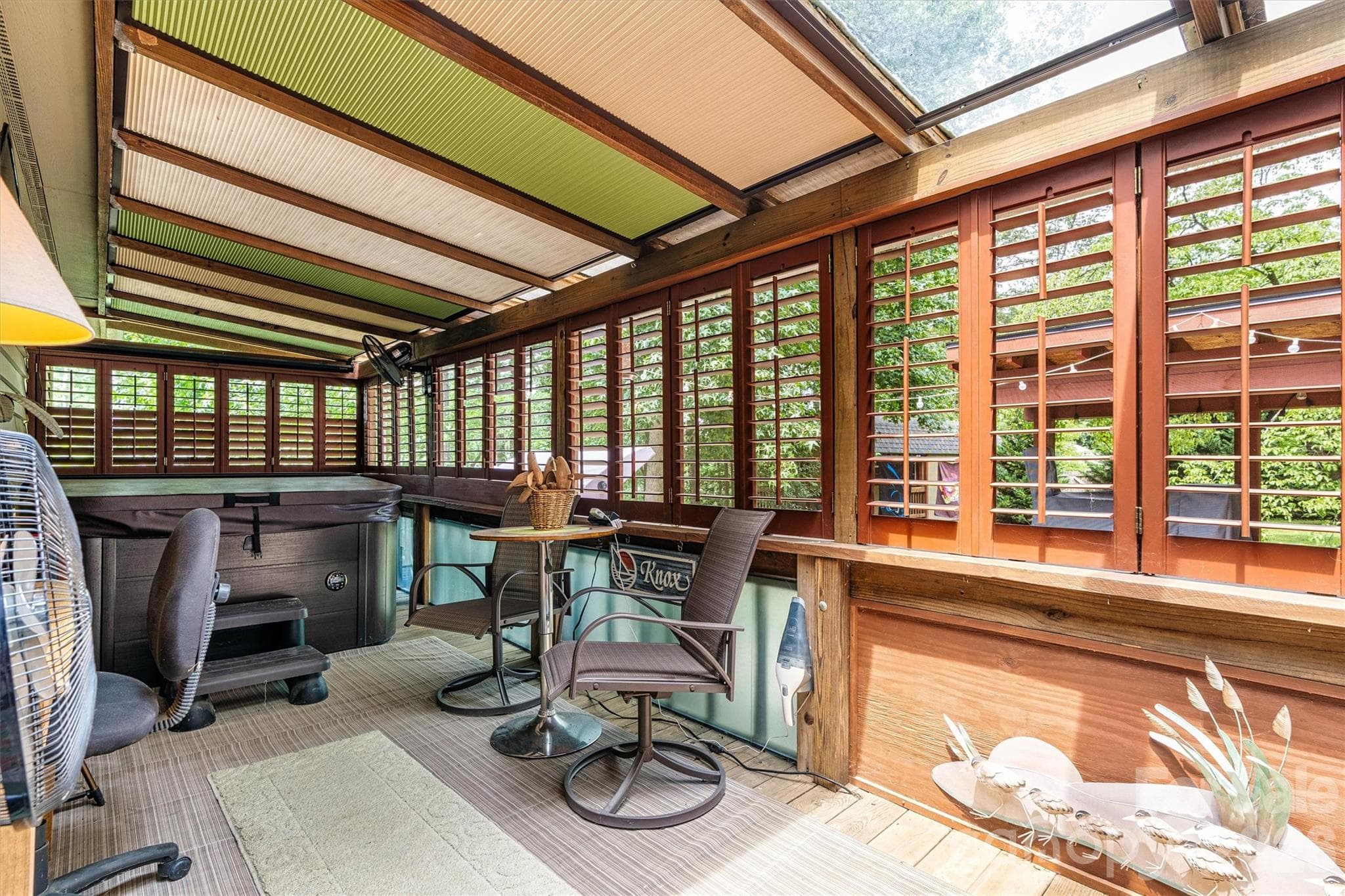 Covered backyard Patio with hot tub - 7697 Katherine Drive, Denver