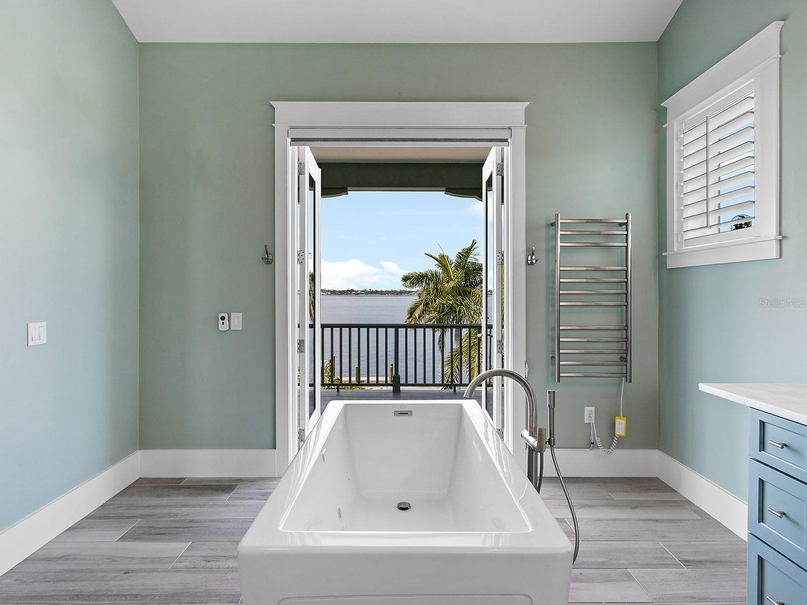 Freestanding soaking tub in the second floor primary bedroom with Manatee River views - 4024 11TH STREET CT W, PALMETTO