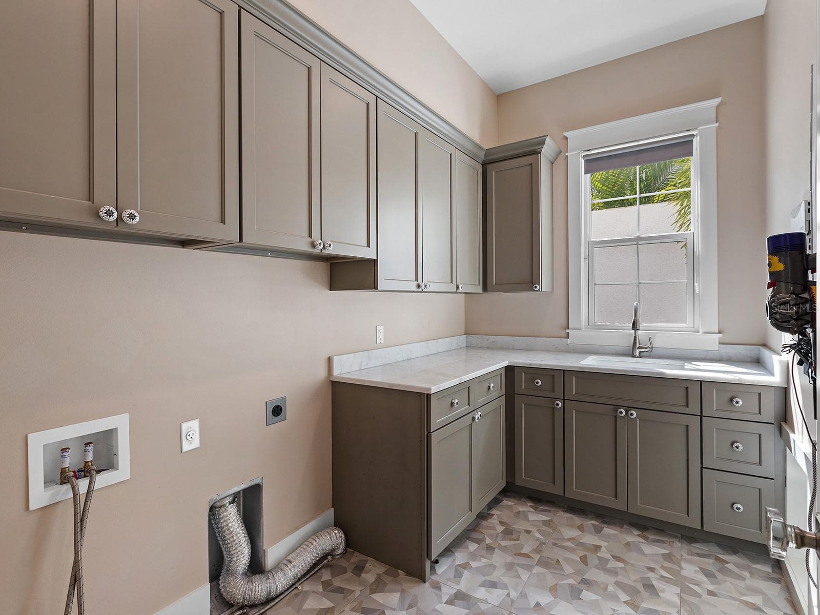 Ground floor laundry room adjacent to the staircase - 4024 11TH STREET CT W, PALMETTO