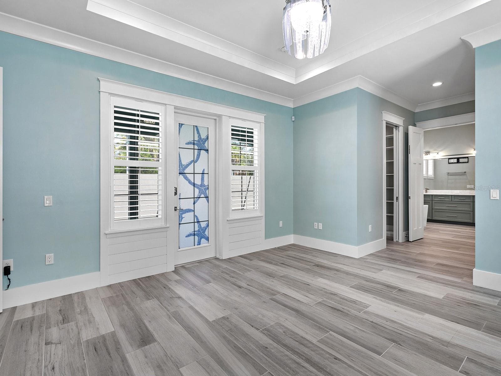 From your primary bedroom, walk outside to a covered relaxing space on the nearly 70-foot pool deck - 4024 11TH STREET CT W, PALMETTO