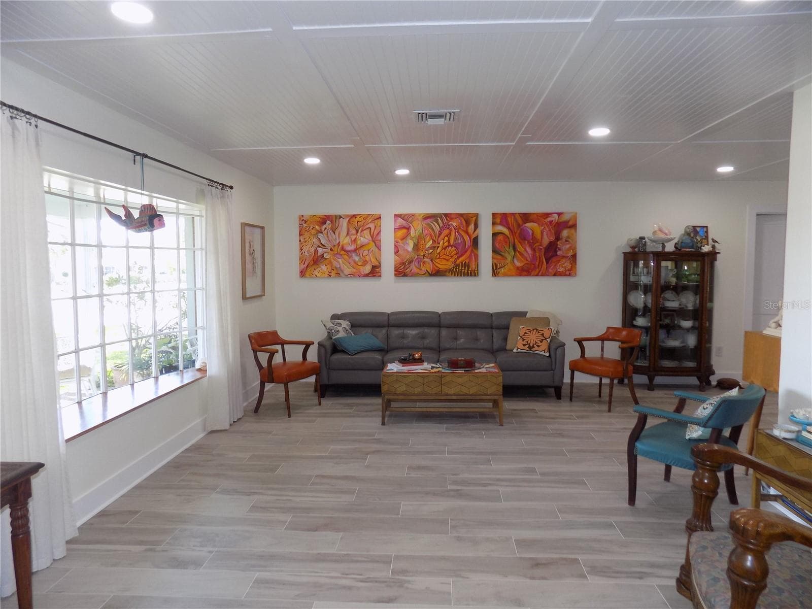 Spacious front Living Room with Bay Window & beadboard ceiling with recessed lighting - 1874 WATEROAK DR W, CLEARWATER