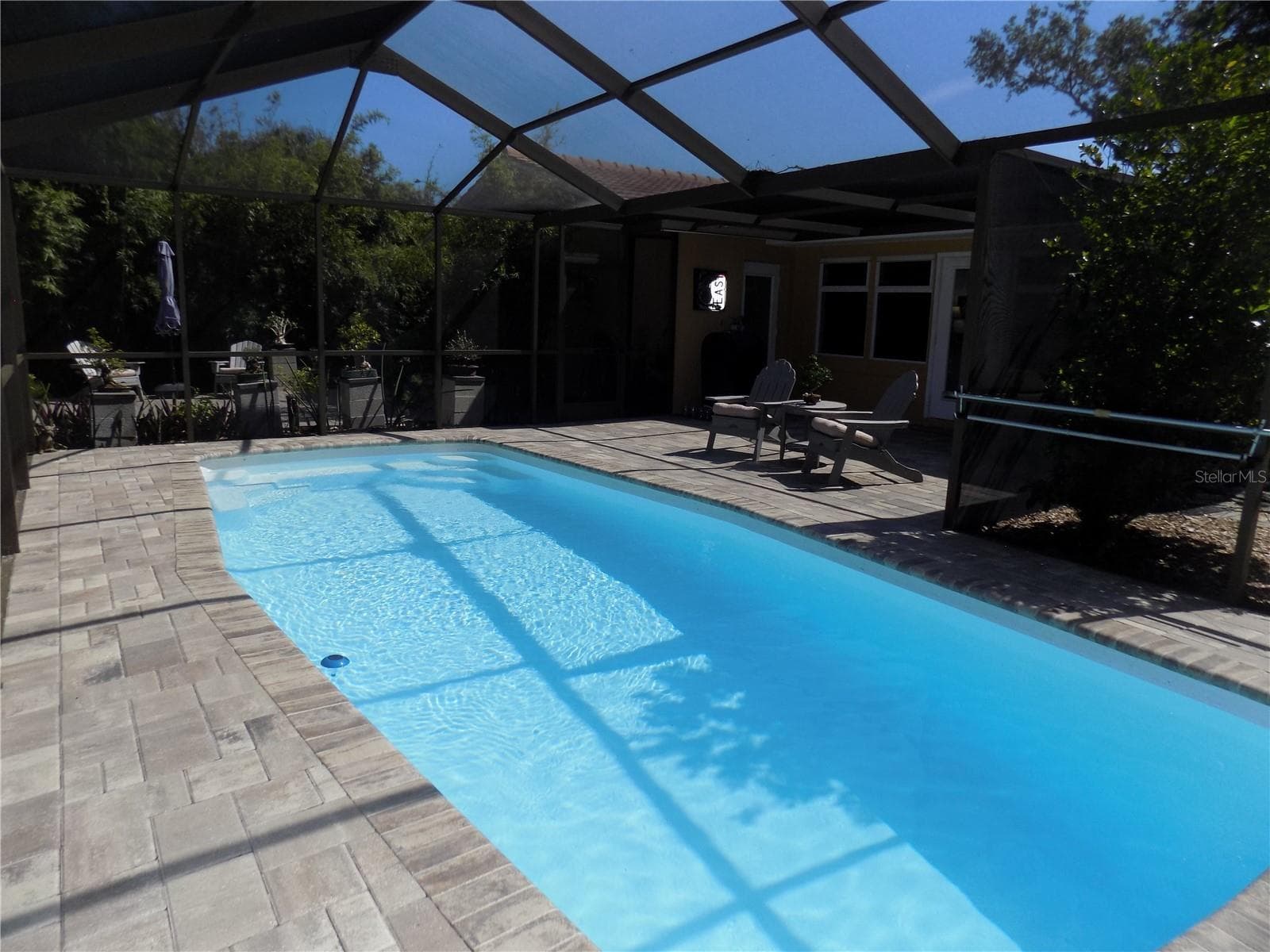 Fiberglass pool re-surfaced in 2019. New pump & filter in '24 - 1874 WATEROAK DR W, CLEARWATER