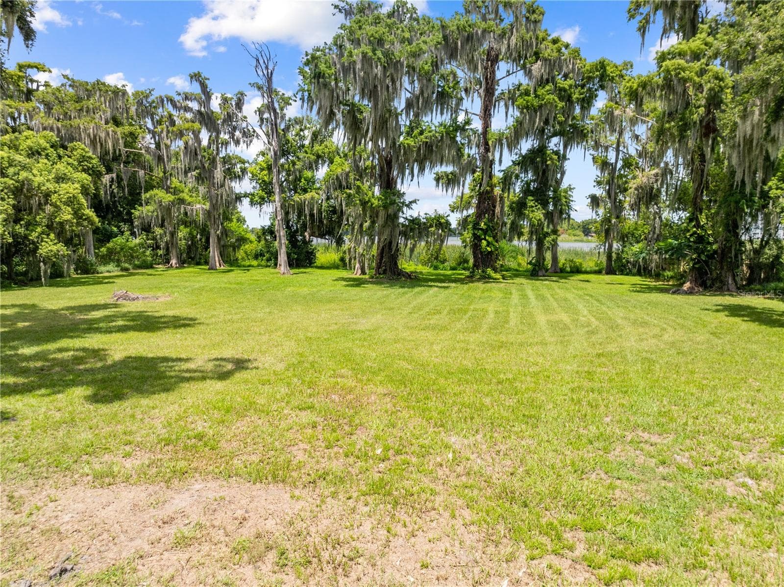 View of the lake from the home. - 2557 AMES HAVEN RD, KISSIMMEE