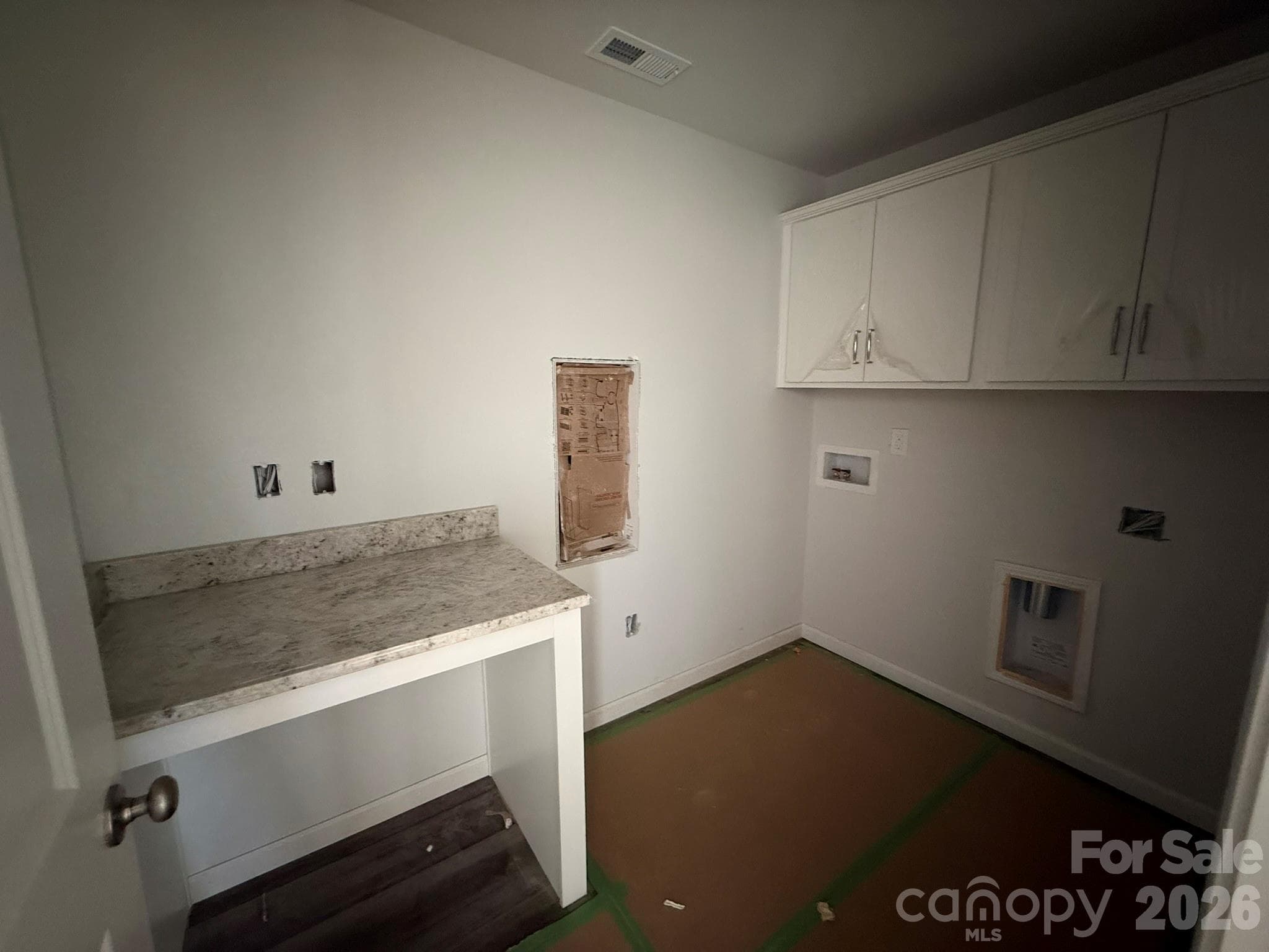 Laundry Room with Cabinets and folding station - 4017 Juno Drive, Charlotte
