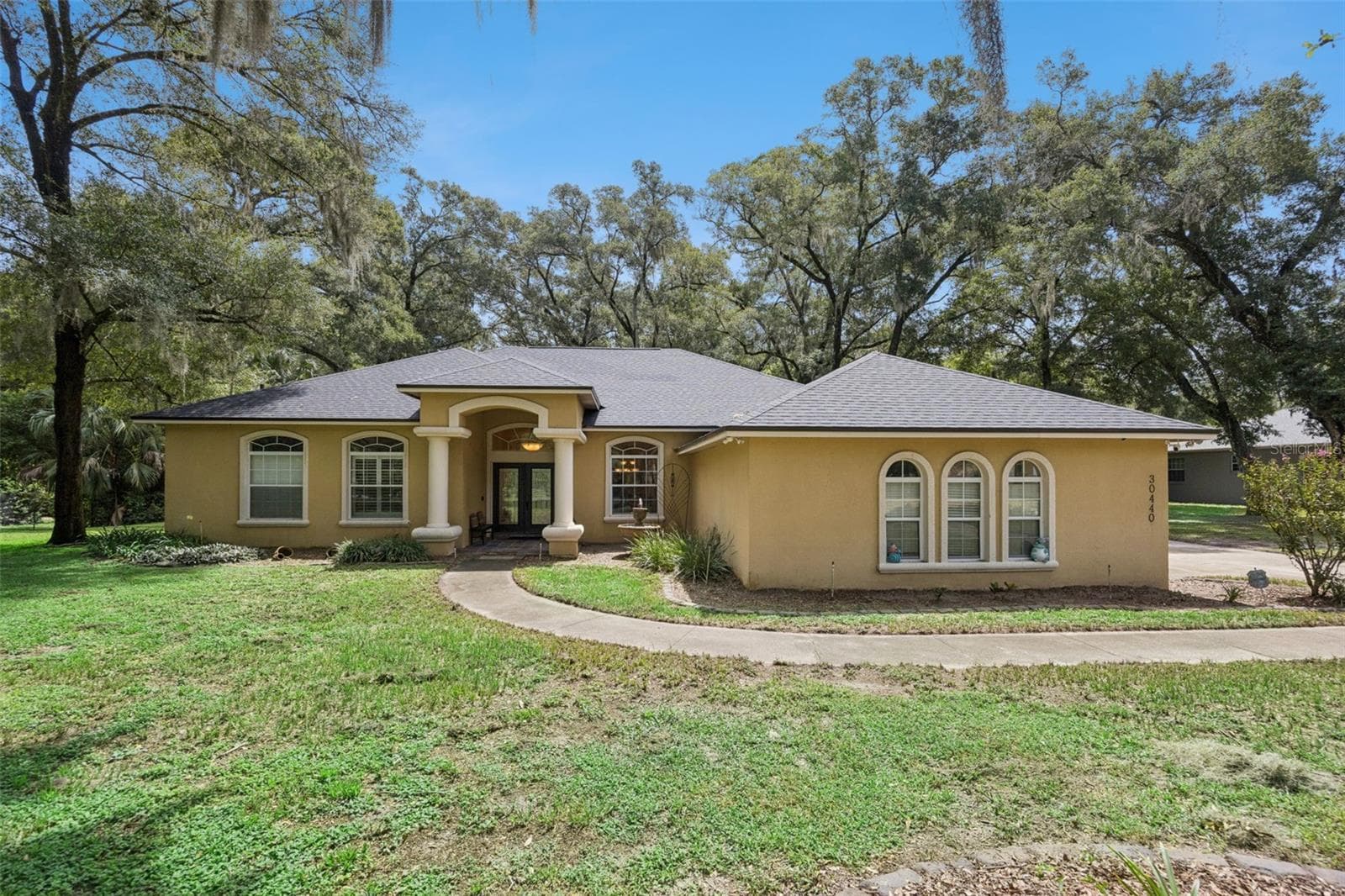Welcome to 30440 Jubilee Way, a 4-bedroom, 3.5-bath pool home on 1.14 acres in Sorrento. - 30440 JUBILEE WAY, SORRENTO