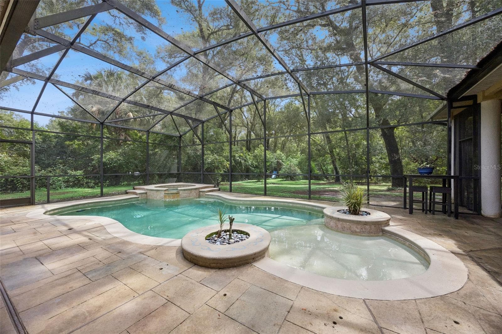 Screened pool and spa create a private outdoor retreat surrounded by mature trees. - 30440 JUBILEE WAY, SORRENTO