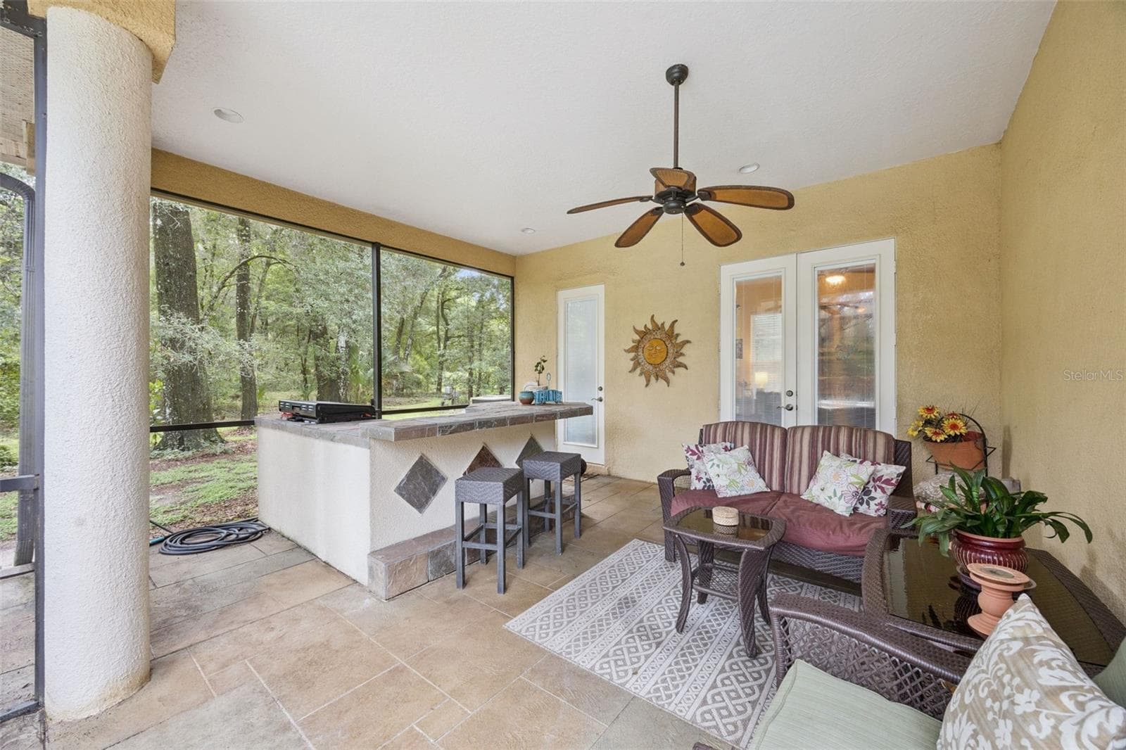 Covered lanai with outdoor kitchen makes entertaining by the pool easy year-round. A perfect spot for evening entertaining with friends. - 30440 JUBILEE WAY, SORRENTO