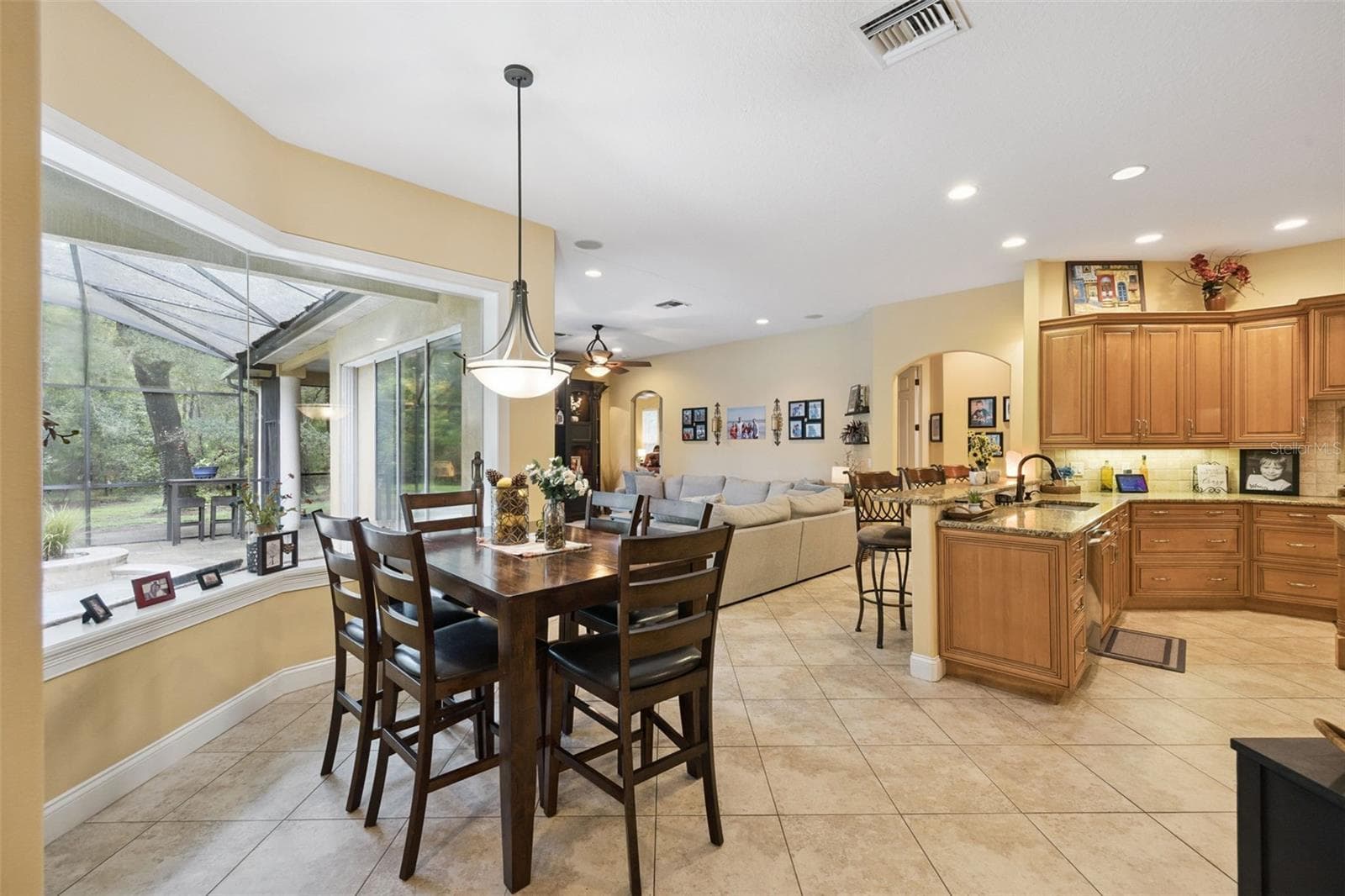 Kitchen and breakfast nook overlook the screened outdoor living area. - 30440 JUBILEE WAY, SORRENTO