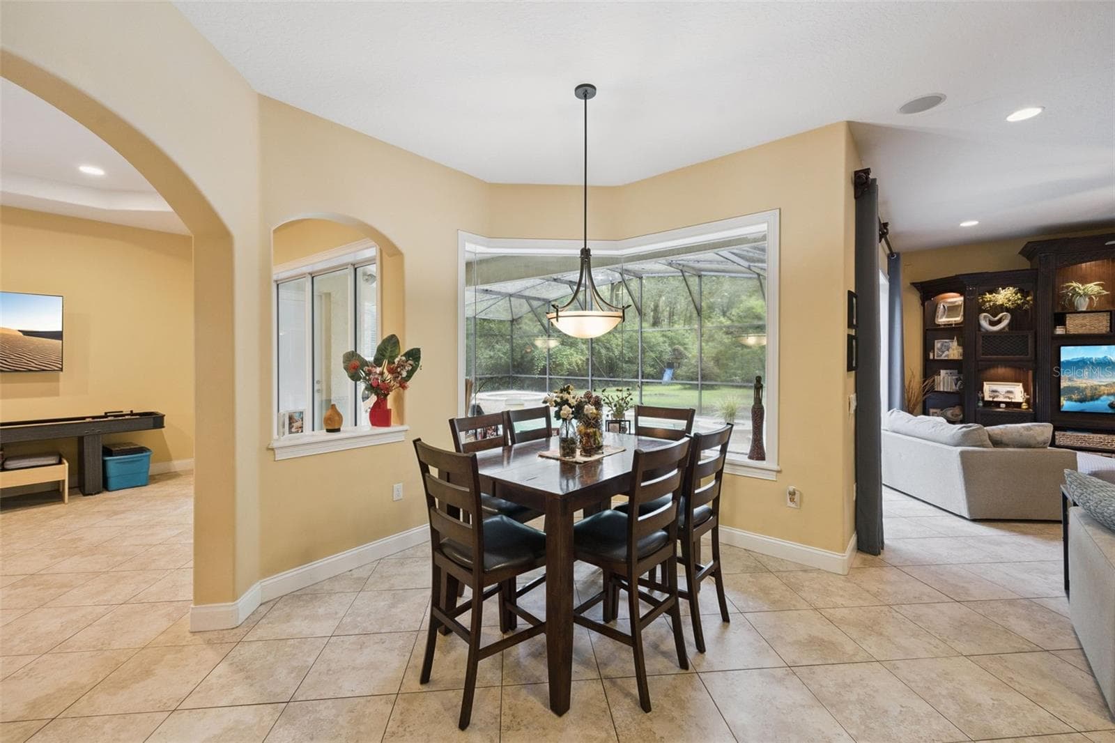 Casual dining area is surrounded by views toward the lanai and backyard. - 30440 JUBILEE WAY, SORRENTO