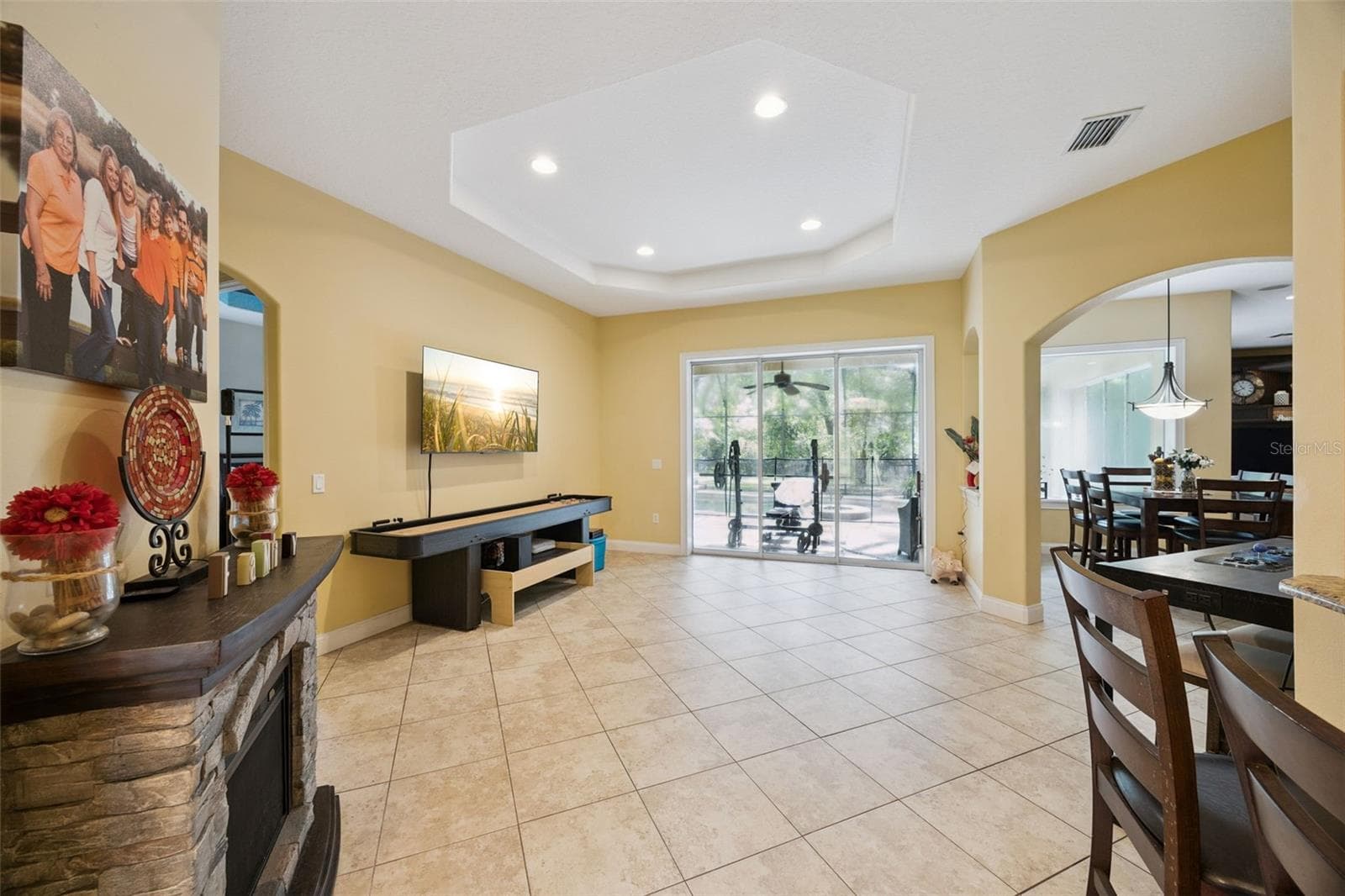 Flexible living space offers direct sightlines to the dining area and screened lanai. - 30440 JUBILEE WAY, SORRENTO