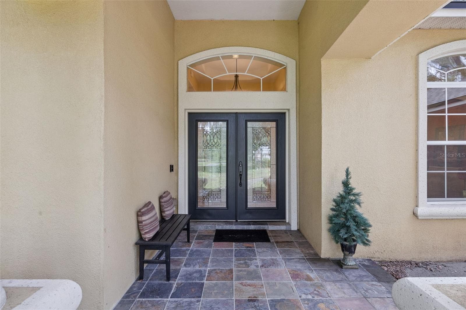 Covered front entry with double doors and architectural detailing. - 30440 JUBILEE WAY, SORRENTO