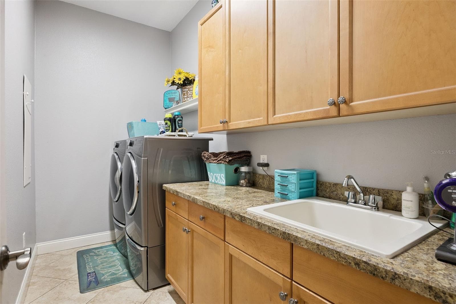 Separate laundry room includes cabinetry, utility sink and additional storage. - 30440 JUBILEE WAY, SORRENTO