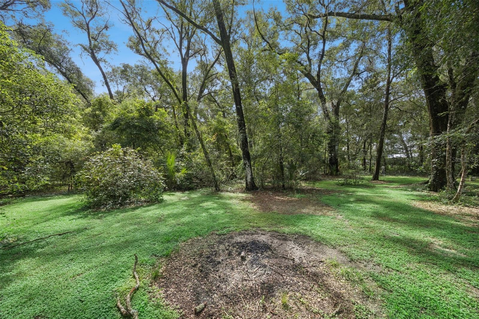 The 1.14-acre setting blends usable yard space with a wooded country feel. - 30440 JUBILEE WAY, SORRENTO