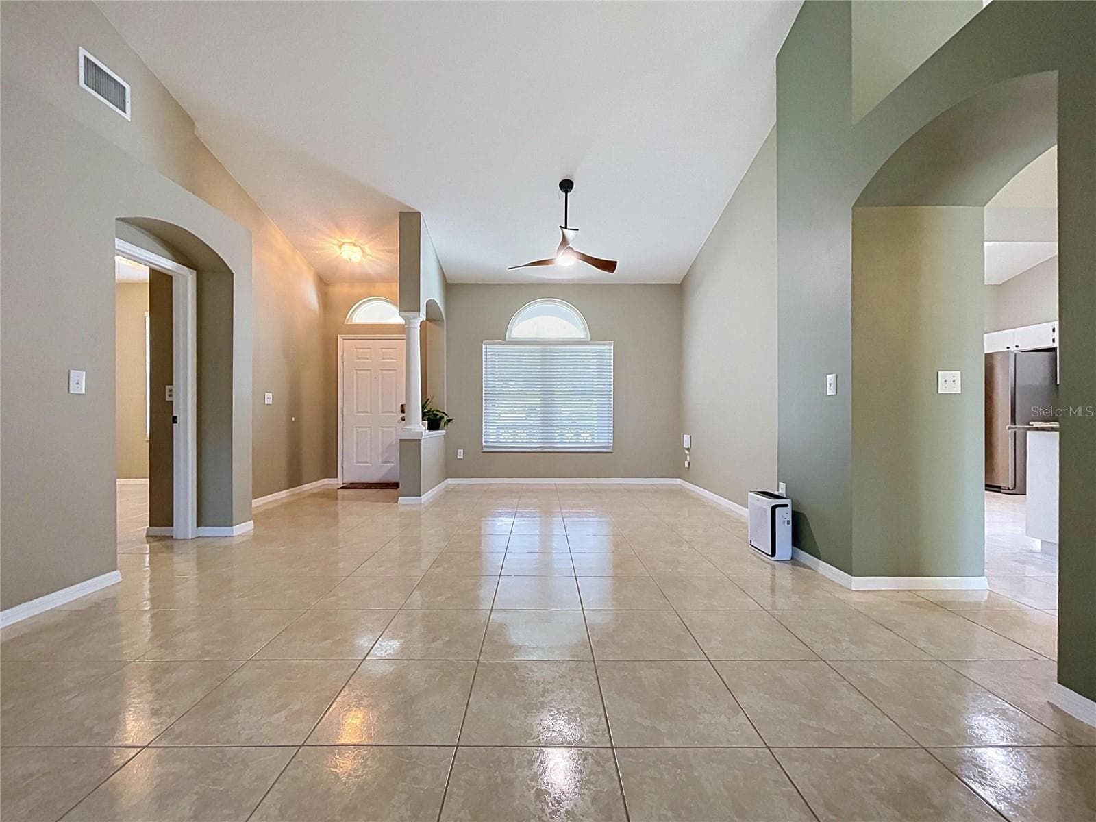 Dining Room and Living Room. Entrance to bedroom #2 to the left. - 4209 AMBER RIDGE LN, VALRICO