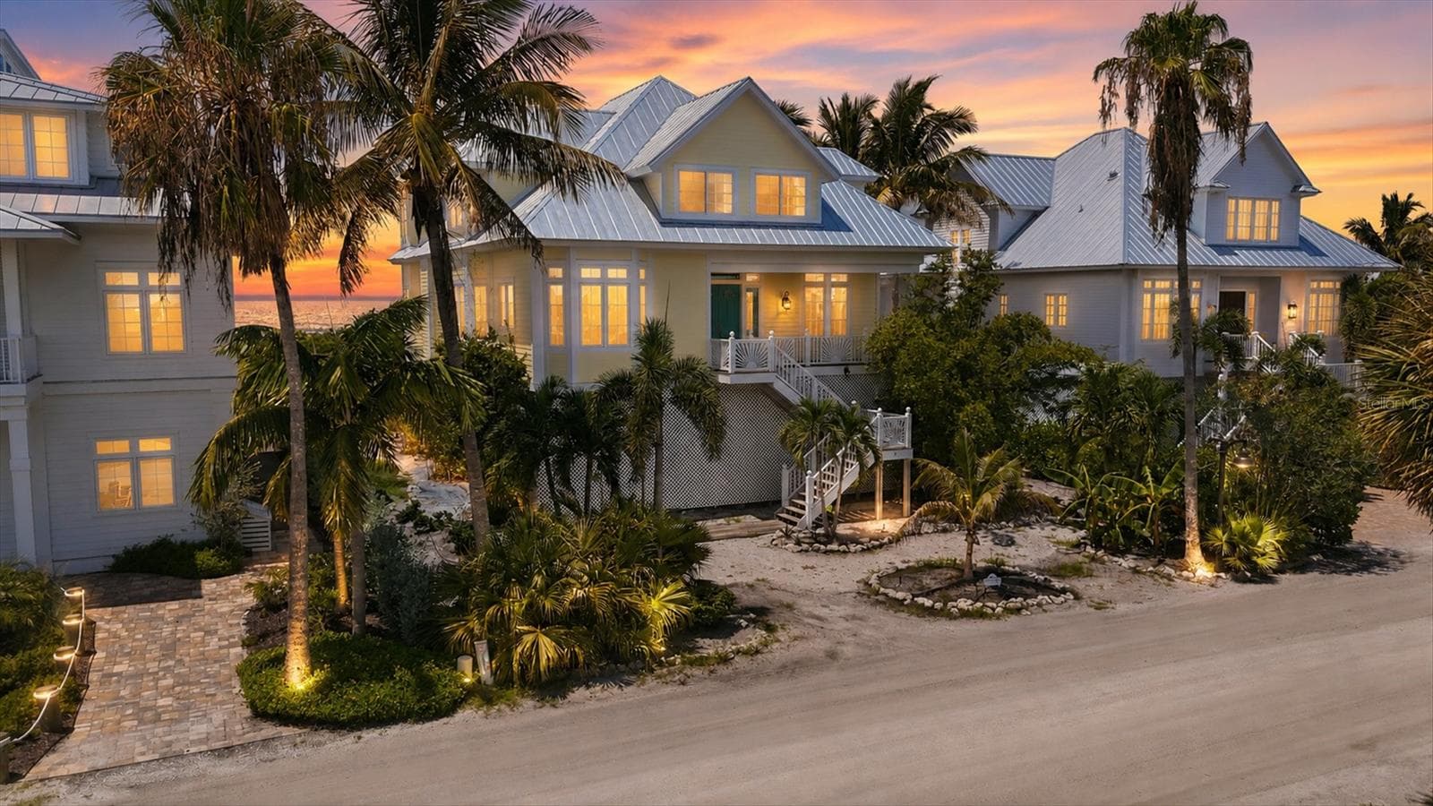 Front elevation with tropical landscaping - 7394 PALM ISLAND DR, PLACIDA