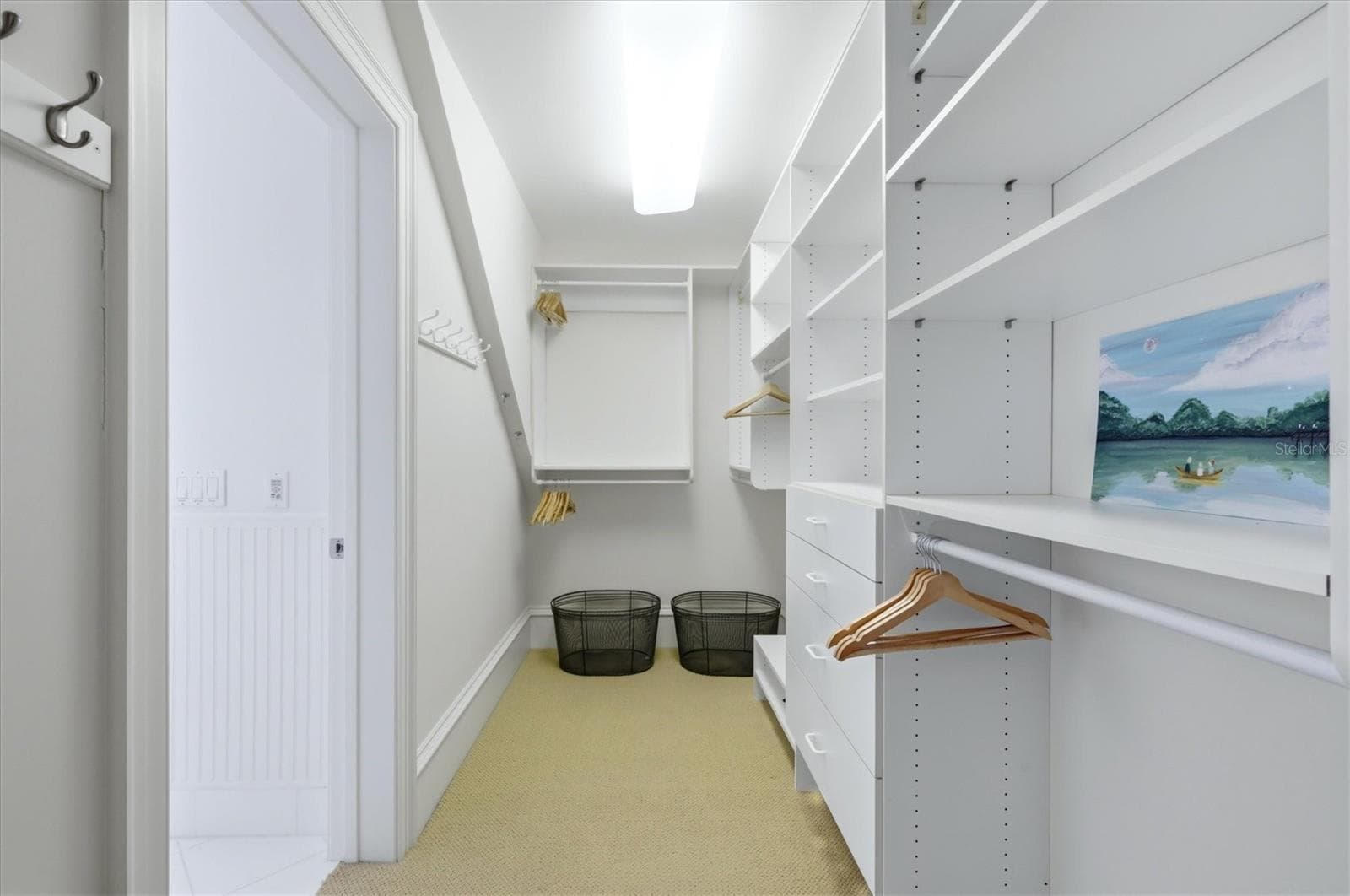 Primary closet with custom built-ins - 7394 PALM ISLAND DR, PLACIDA