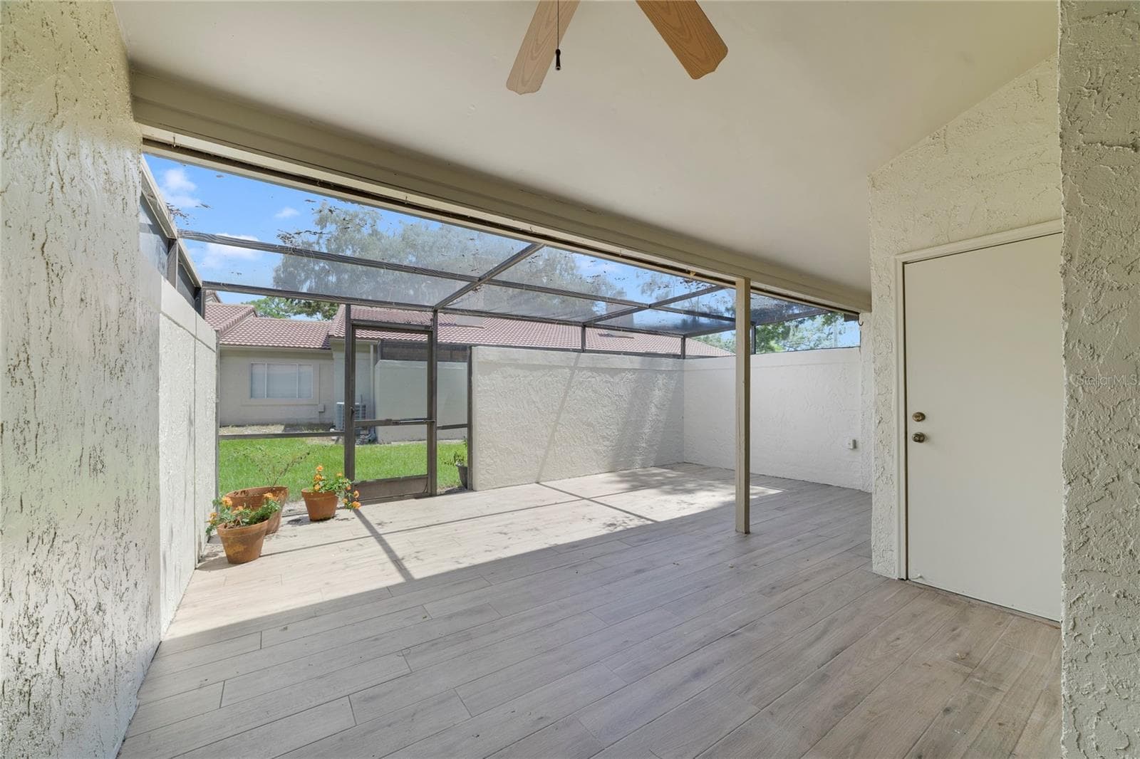 Spacious Screened and Partially Covered Rear Porch has  a Storage Area - 260 W SABAL PALM PL, LONGWOOD